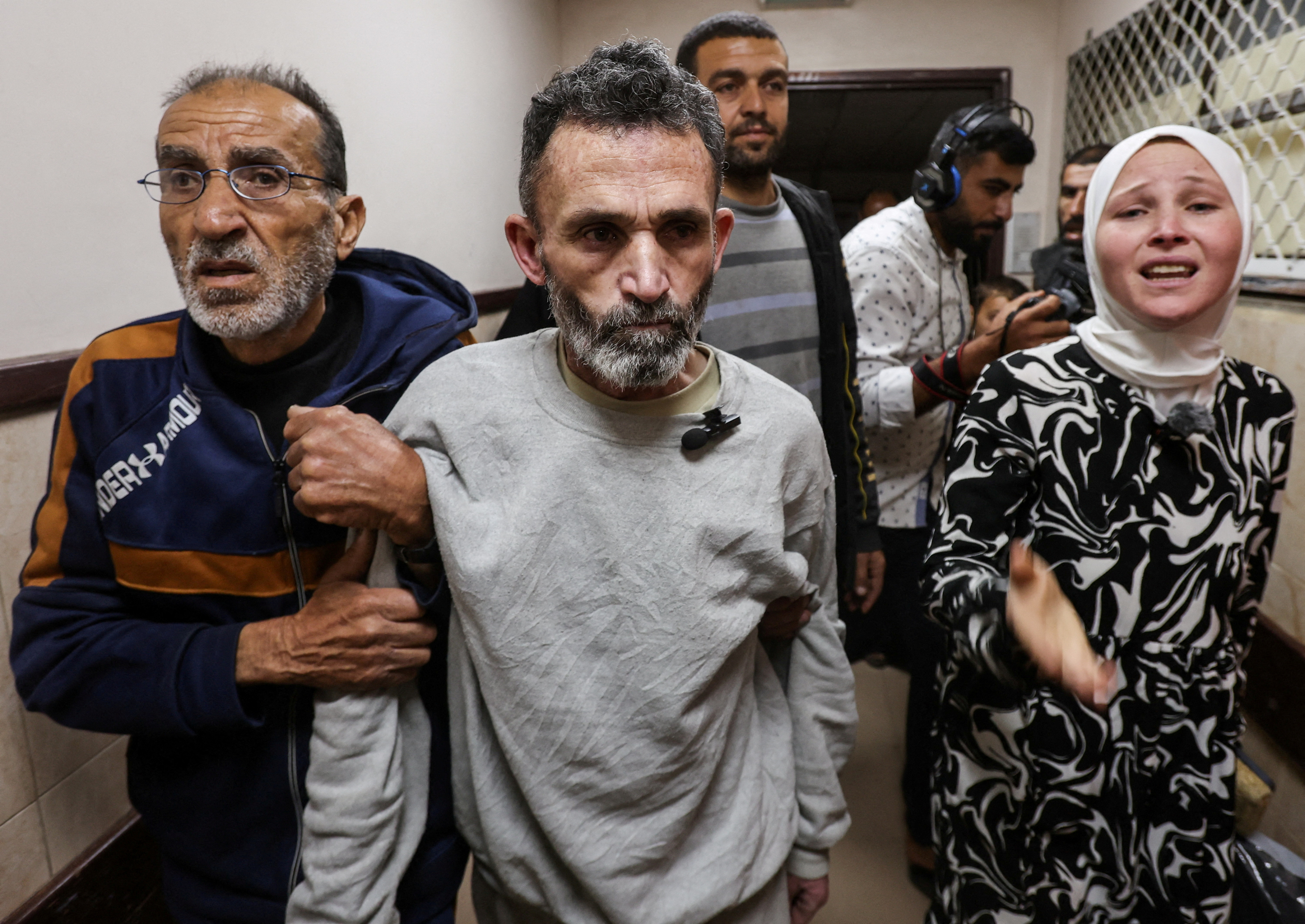 Palestinians, who were detained by Israel, arrive at Al-Aqsa Martyrs hospital after their release, in Deir Al-Balah