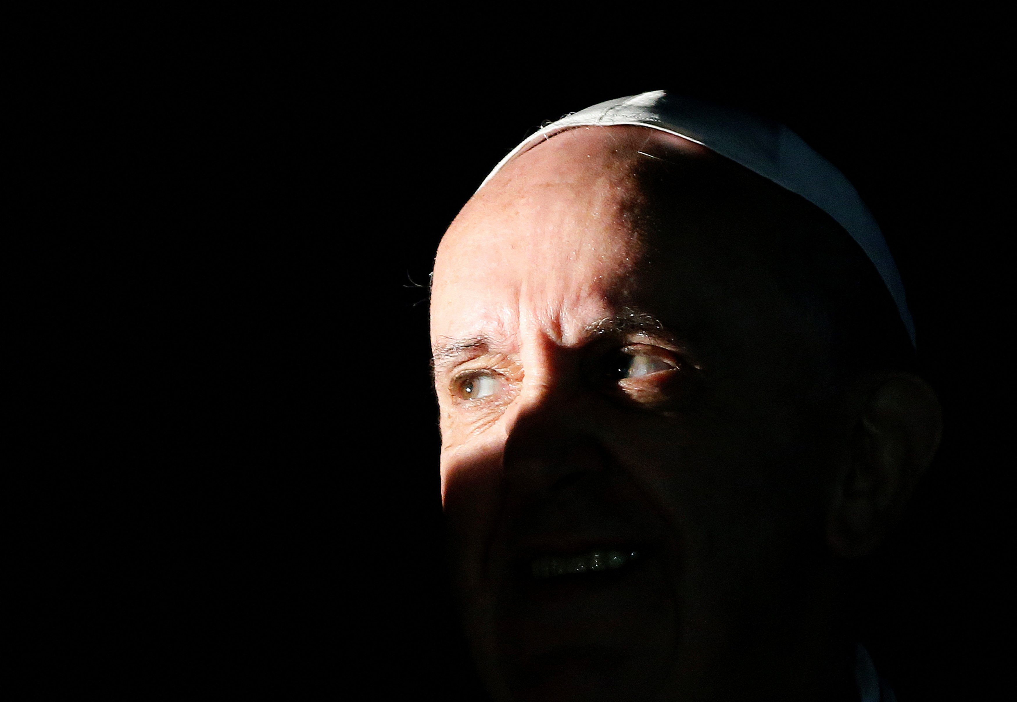 FILE PHOTO: Pope Francis looks on at the end of his pastoral visit at the parish church "Santa Maria dell'Orazione" at Setteville di Guidonia neighborhood of Rome