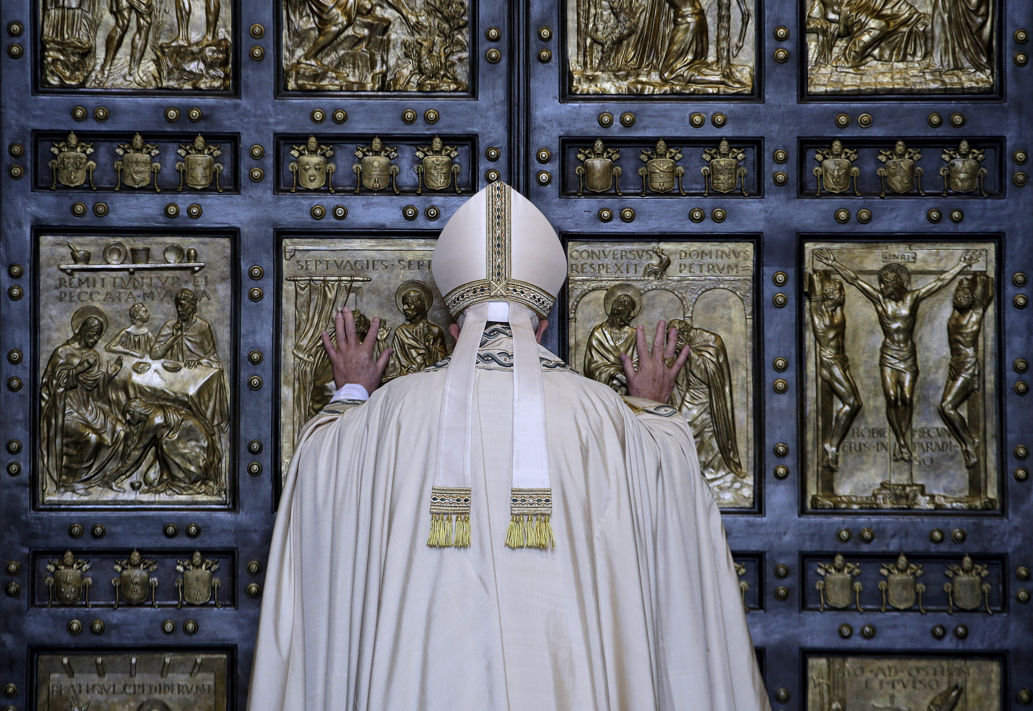 FILE PHOTO: Pope Francis opens the Holy Door to mark opening of the Catholic Holy Year, or Jubilee, in St. Peter's basilica