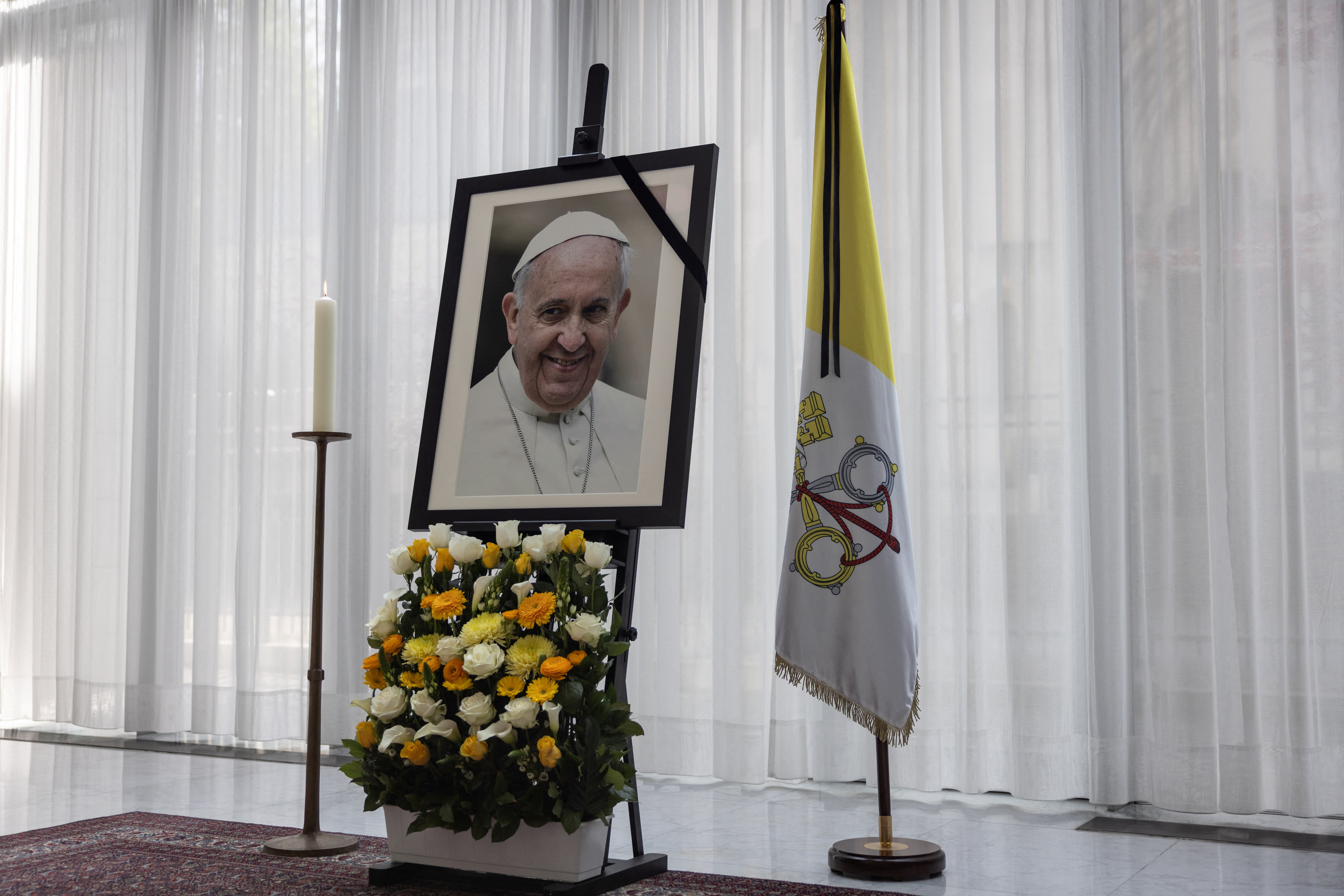 A photograph of Pope Francis is seen at the Apostolic Nunciature, the day that German president Steinmeier signs book of condolences for Pope Francis i