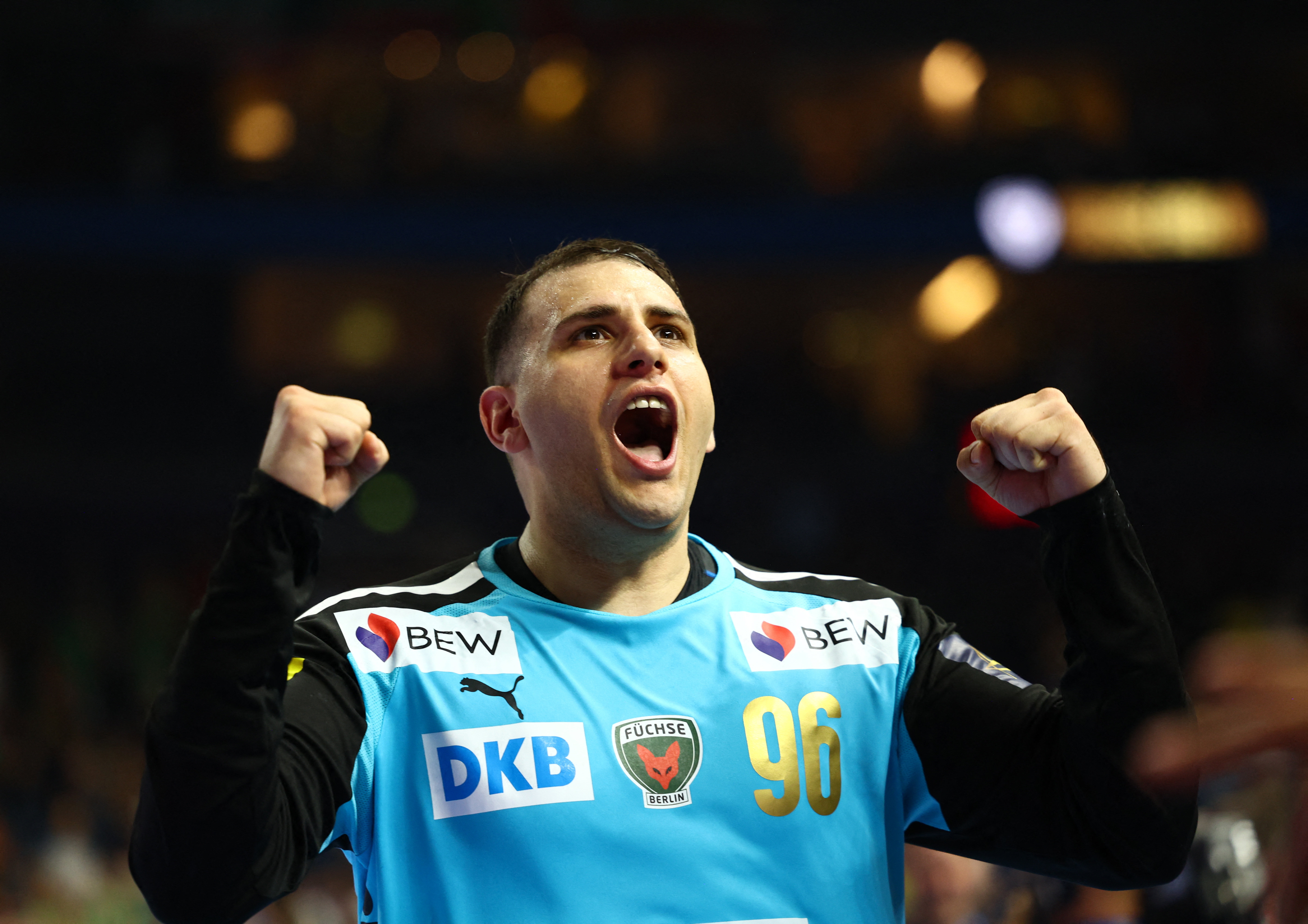 Handball - EHF Men's Handball Champions League - Semi Finals - Fuchse Berlin v HBC Nantes - Lanxess Arena, Cologne, Germany - June 14, 2025 Fuchse Berlin's Dejan Milosavljev celebrates after the match REUTERS/Leon Kuegeler