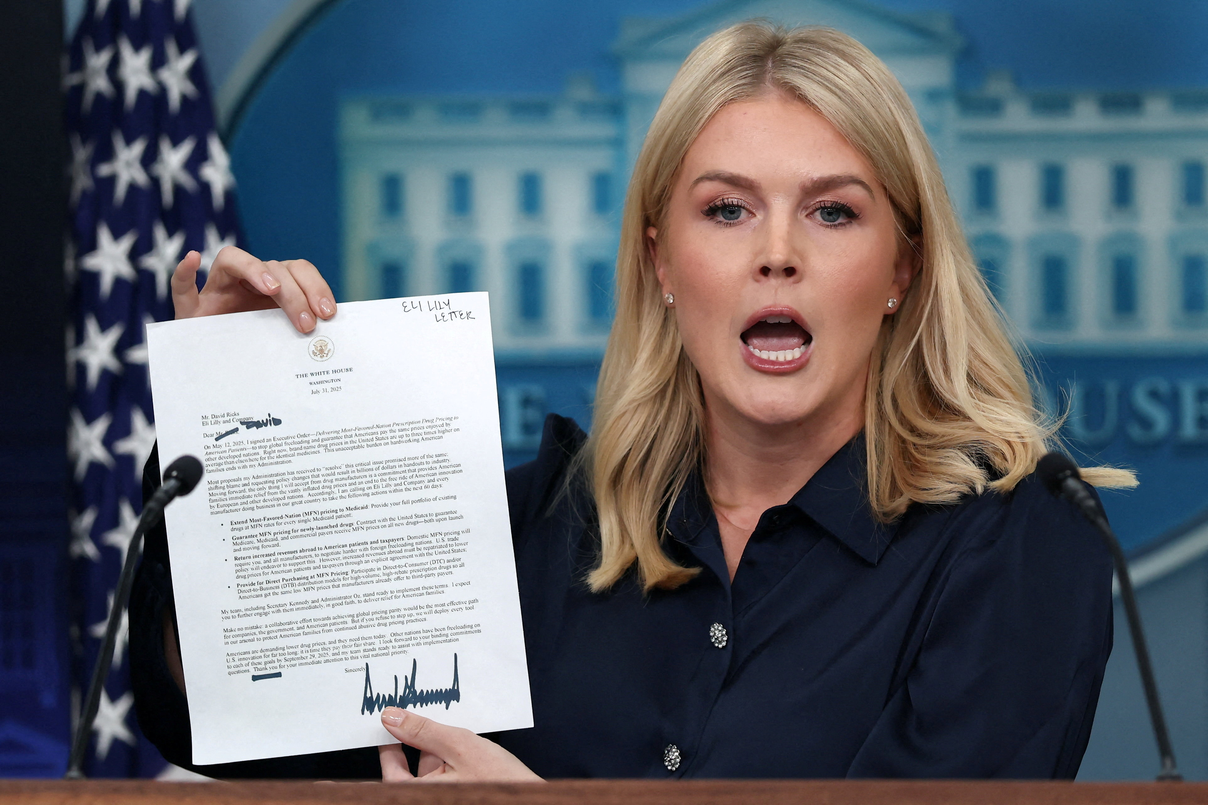 White House Press Secretary Karoline Leavitt holds U.S. President Donald Trump's letter to Eli Lilly CEO David Ricks during a press briefing at the White House in Washington, D.C., U.S., July 31, 2025. REUTERS/Evelyn Hockstein     TPX IMAGES OF THE DAY