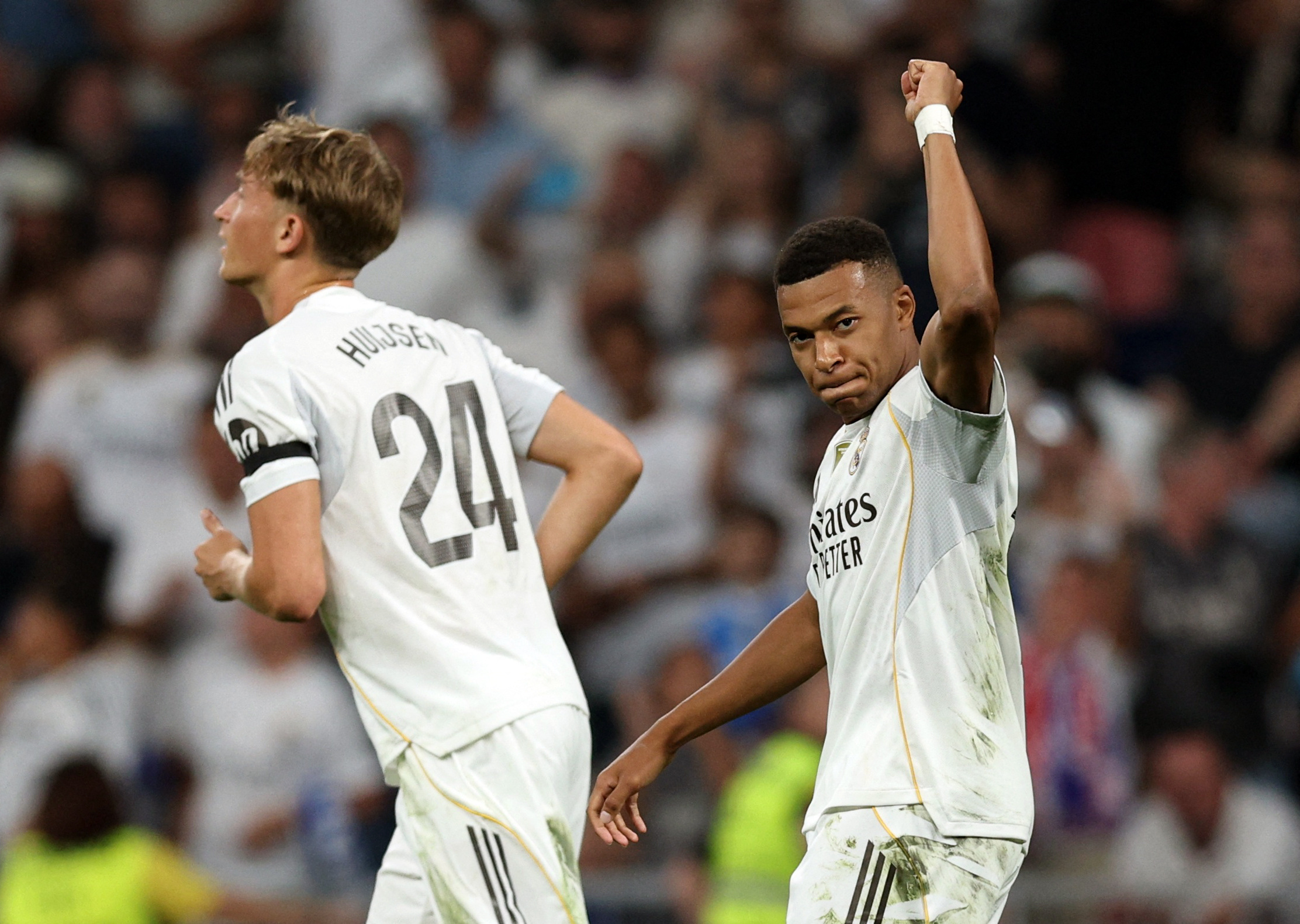 Soccer Football - LaLiga - Real Madrid v Osasuna - Santiago Bernabeu, Madrid, Spain - August 19, 2025 Real Madrid's Kylian Mbappe celebrates scoring their first goal with Real Madrid's Dean Huijsen REUTERS/Violeta Santos Moura
