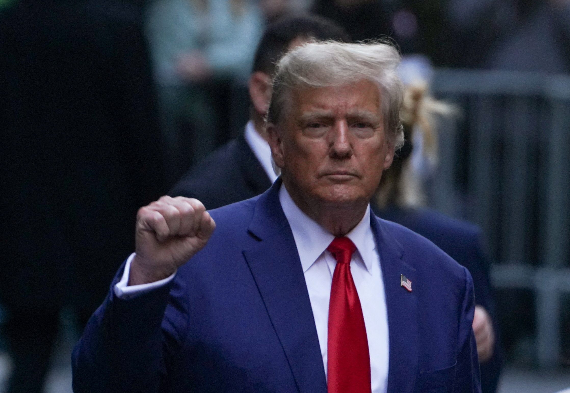 FILE PHOTO: Former U.S. President Donald Trump gestures to his supporters