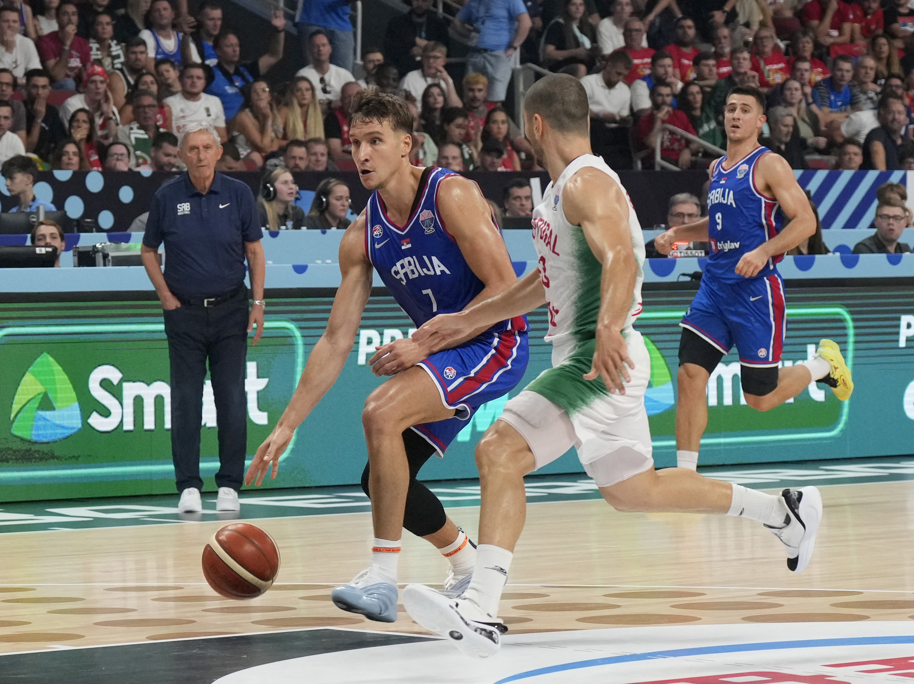 Basketball - FIBA EuroBasket 2025 - Group Phase - Portugal v Serbia - Xiaomi Arena, Riga, Latvia - August 29, 2025 Serbia's Bogdan Bogdanovic in action with Portugal's Diogo Gameiro REUTERS/Ints Kalnins