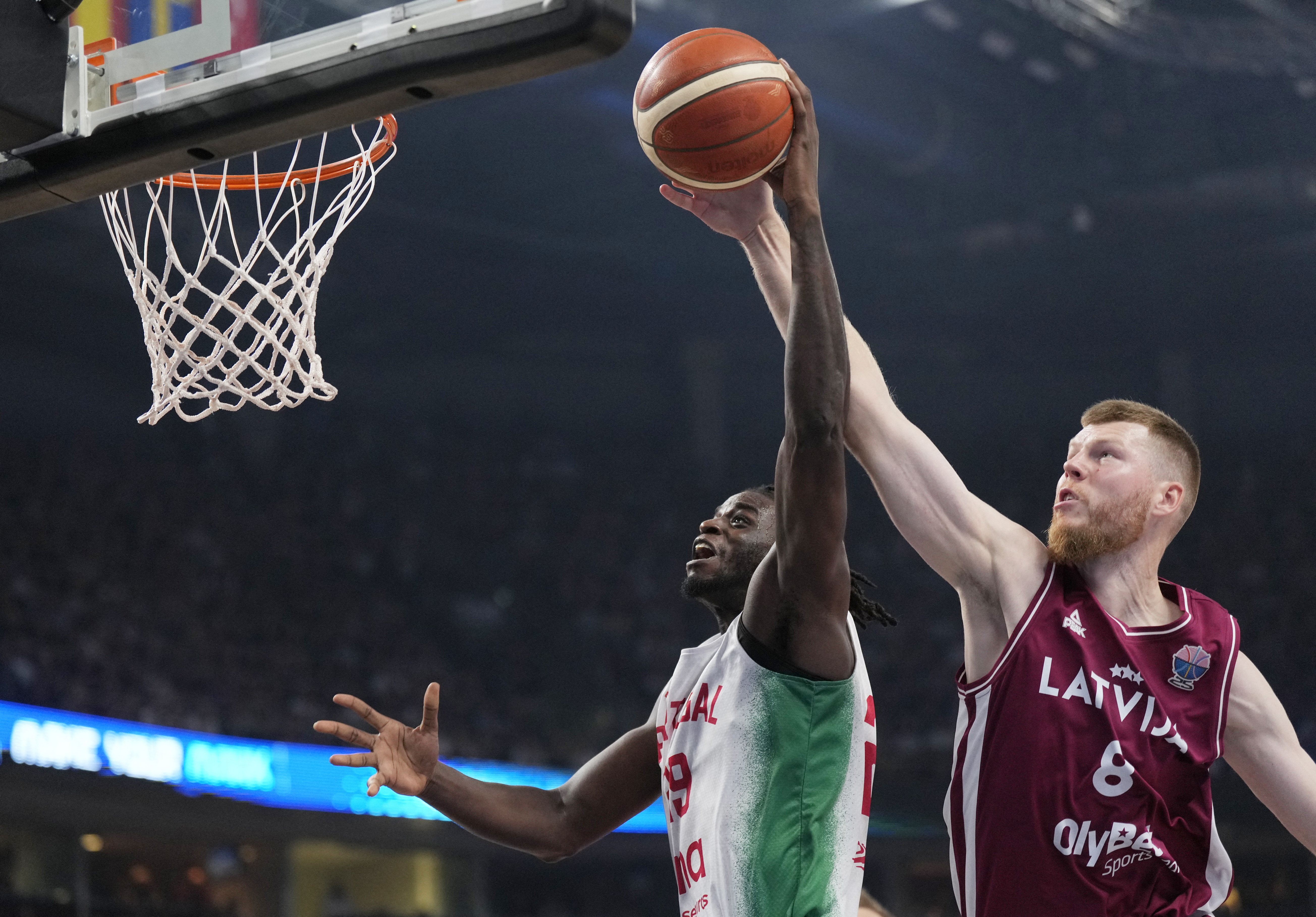 Basketball - FIBA EuroBasket 2025 - Group Phase - Portugal v Latvia - Xiaomi Arena, Riga, Latvia - September 1, 2025 Portugal's Candido Sa in action with Latvia's Davis Bertans REUTERS/Ints Kalnins