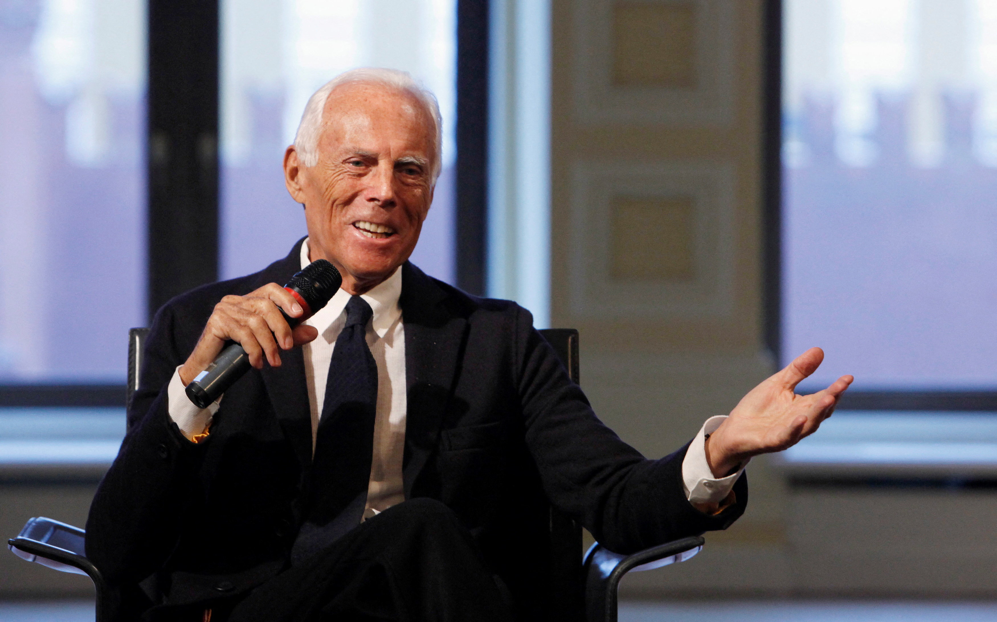 FILE PHOTO: Italian fashion designer Giorgio Armani speaks during his news conference in Moscow October 27, 2009. REUTERS/Denis Sinyakov/File Photo