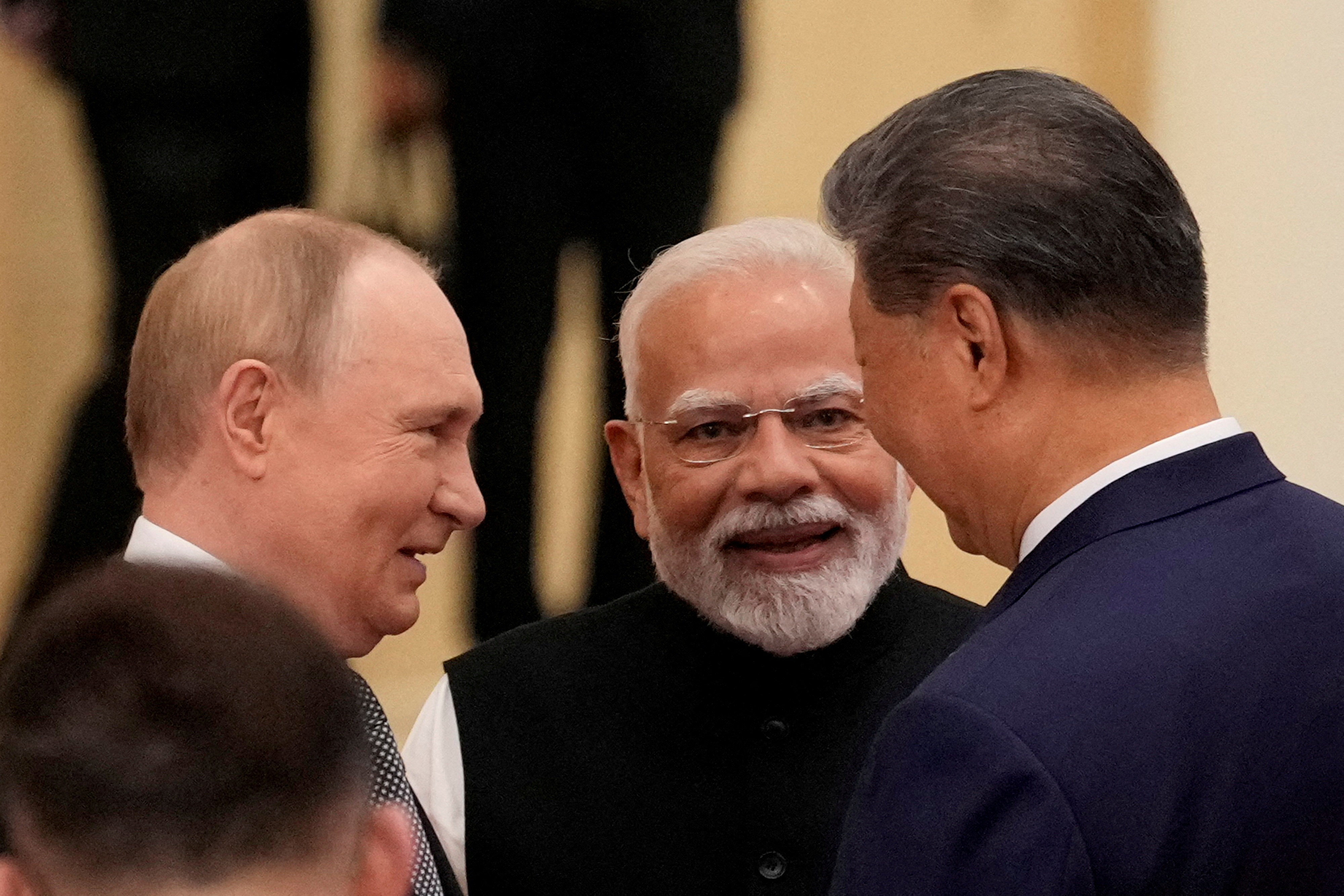 FILE PHOTO: Indian Prime Minister Narendra Modi talks with Russian President Vladimir Putin and Chinese President Xi Jinping