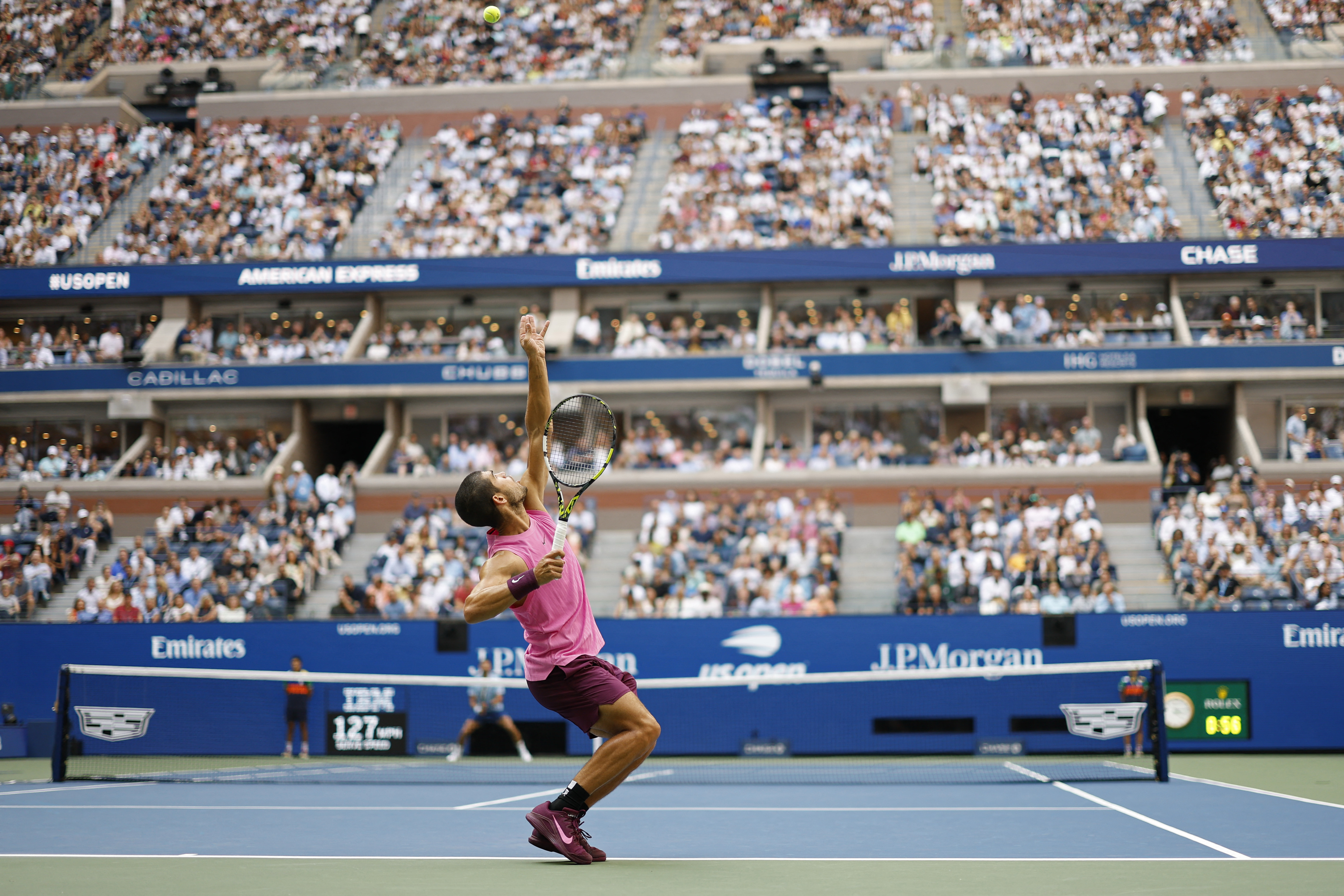 Sep 5, 2025; Flushing, NY, USA; Carlos Alcaraz (ESP) serves against Novak Djokovic
