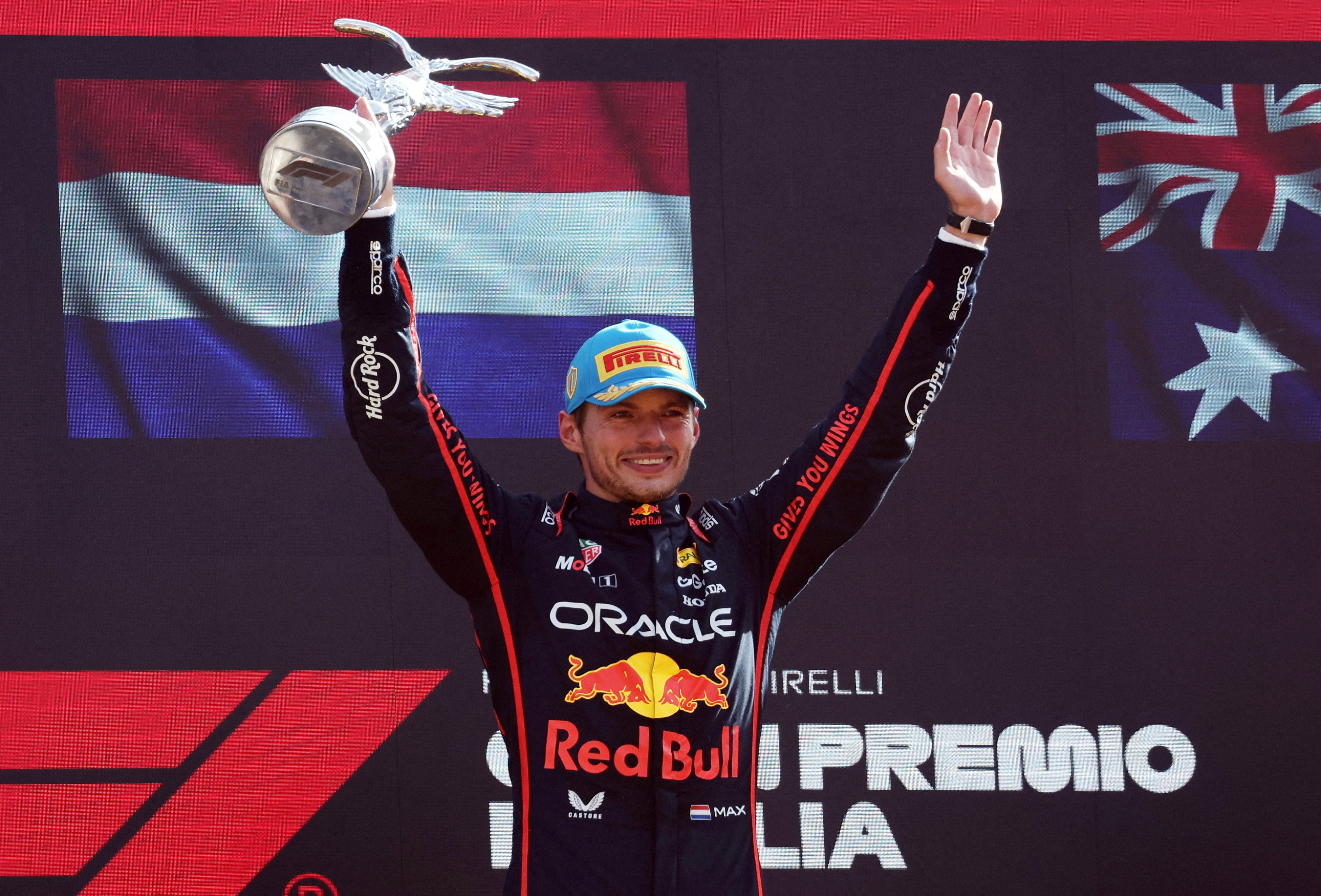 Formula One F1 - Italian Grand Prix - Autodromo Nazionale Monza, Monza, Italy - September 7, 2025 Red Bull's Max Verstappen celebrates on the podium with the trophy after winning the Italian Grand Prix REUTERS/Jakub Porzycki     TPX IMAGES OF THE DAY