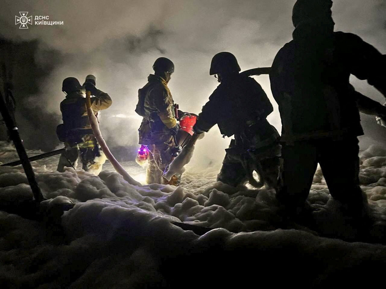 Firefighters work at the site of a thermal power generation