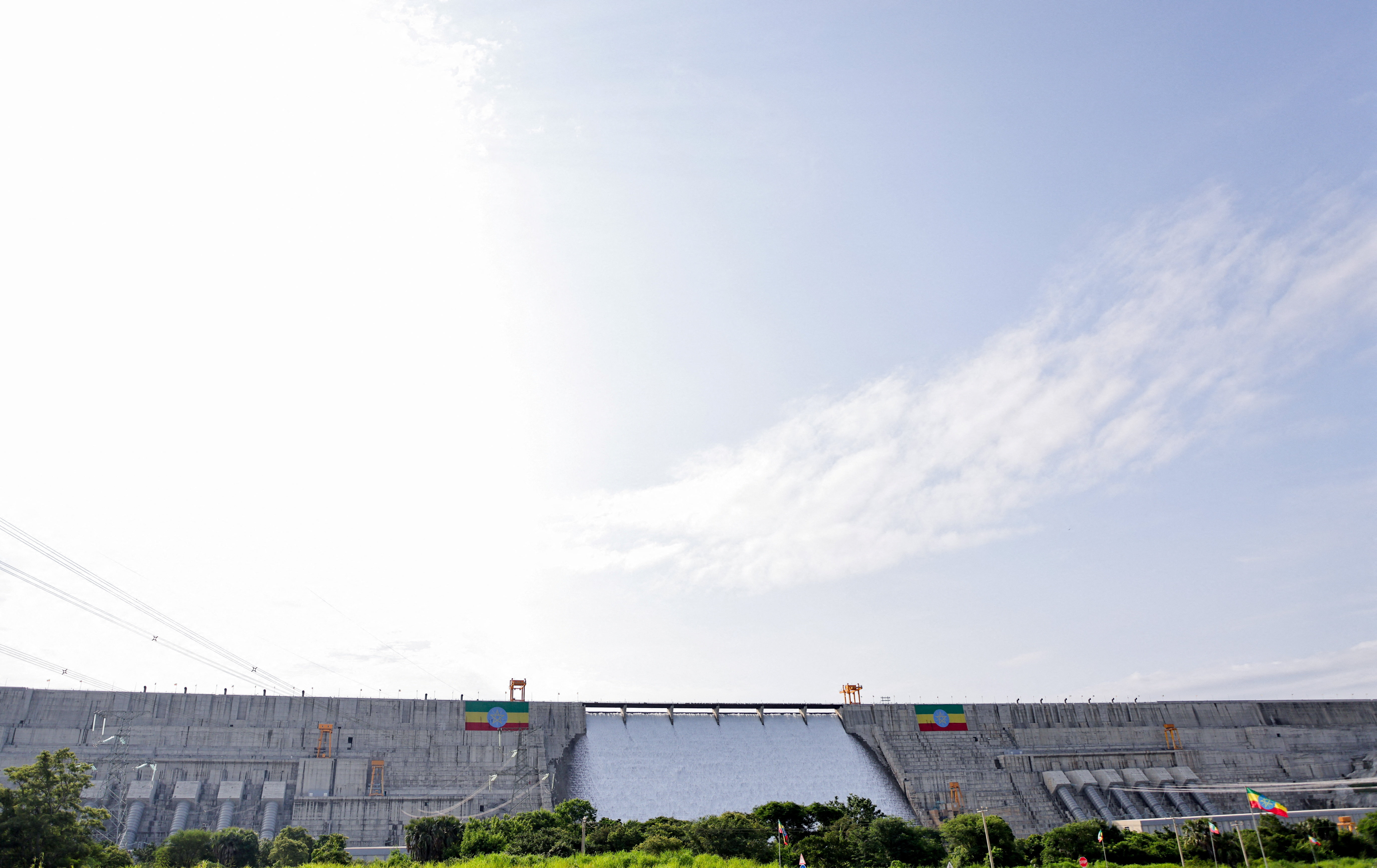 Large Ethiopian flags are displayed on the Grand Ethiopian Renaissance Dam (GERD), built along the Blue Nile, during its inauguration, in Guba, Benishangul-Gumuz region, Ethiopia, September 9, 2025. REUTERS/Tiksa Negeri