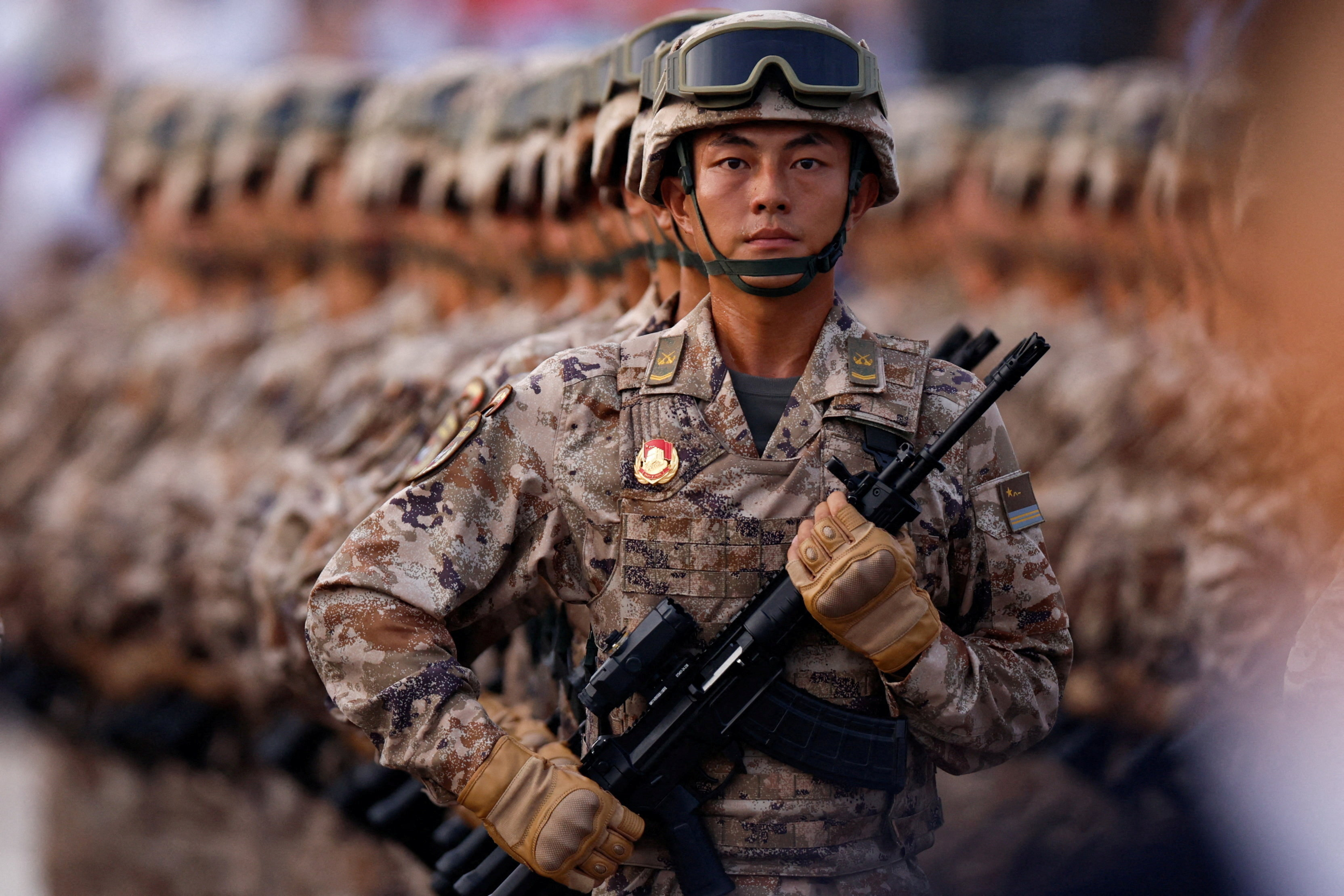 China's cyber force personnel march during the rehearsal ahead of a military parade to mark the 80th anniversary of the end of World War Two, in Beijing, China, September 3, 2025. REUTERS/Tingshu Wang        TPX IMAGES OF THE DAY