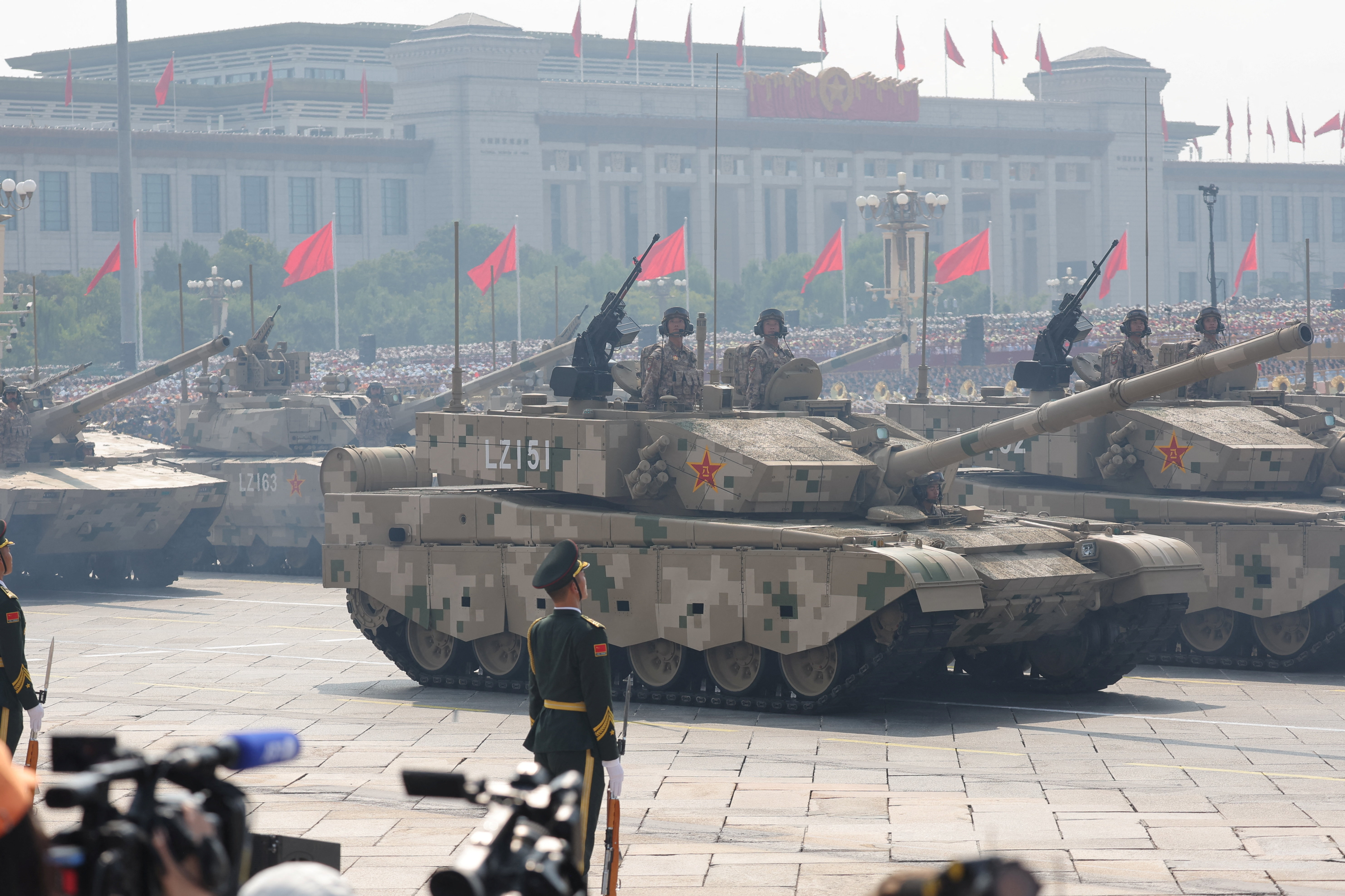 Members of the People's Liberation Army stand as the land operations group displays tanks during a military parade to mark the 80th anniversary of the end of World War Two, in Beijing, China, September 3, 2025. REUTERS/Maxim Shemetov