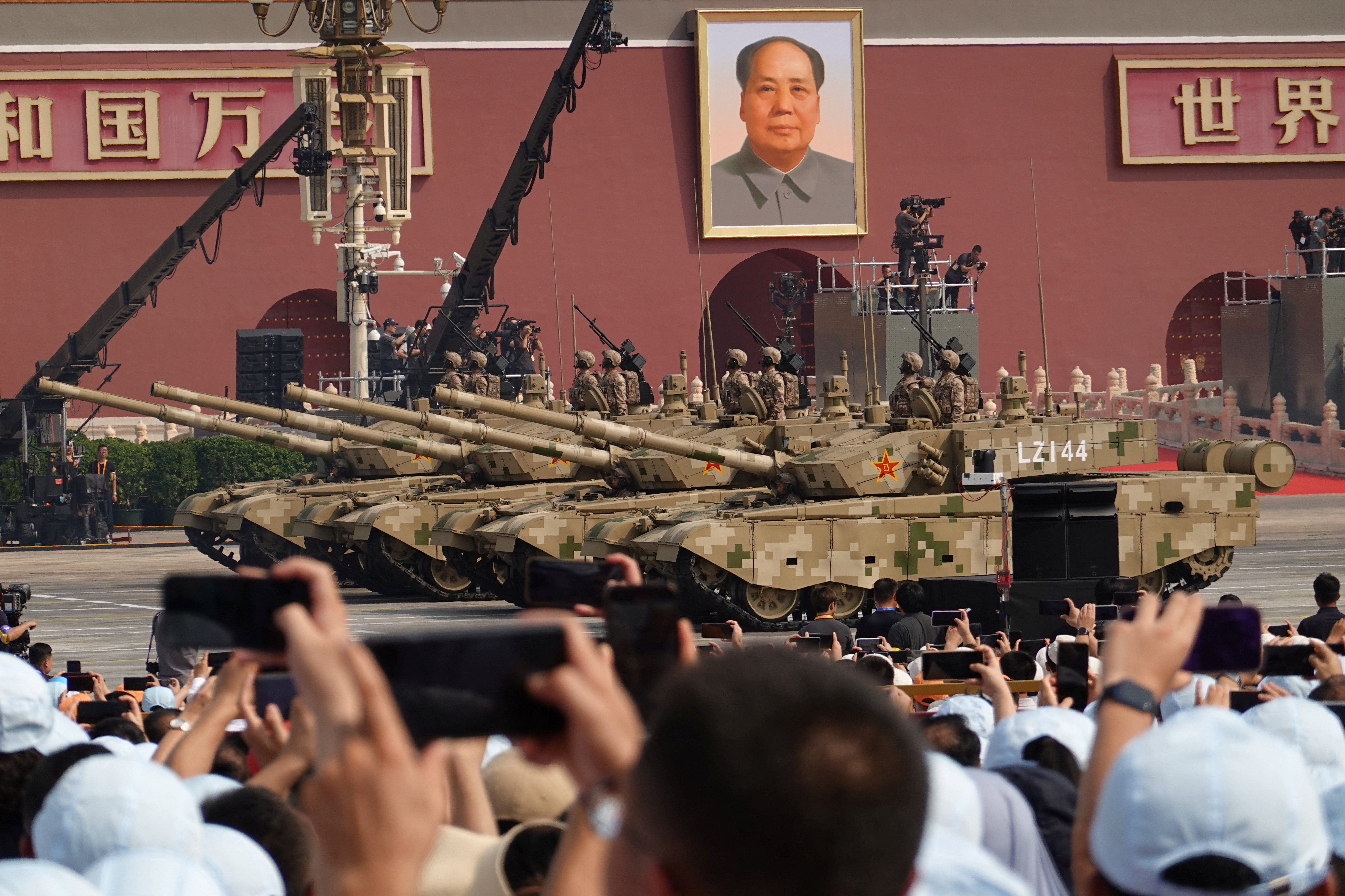 Members of the People's Liberation Army Ground Assault Force stand on armoured vehicles during a military parade to mark the 80th anniversary of the end of World War Two, in Beijing, China, September 3, 2025. REUTERS/Go Nakamura