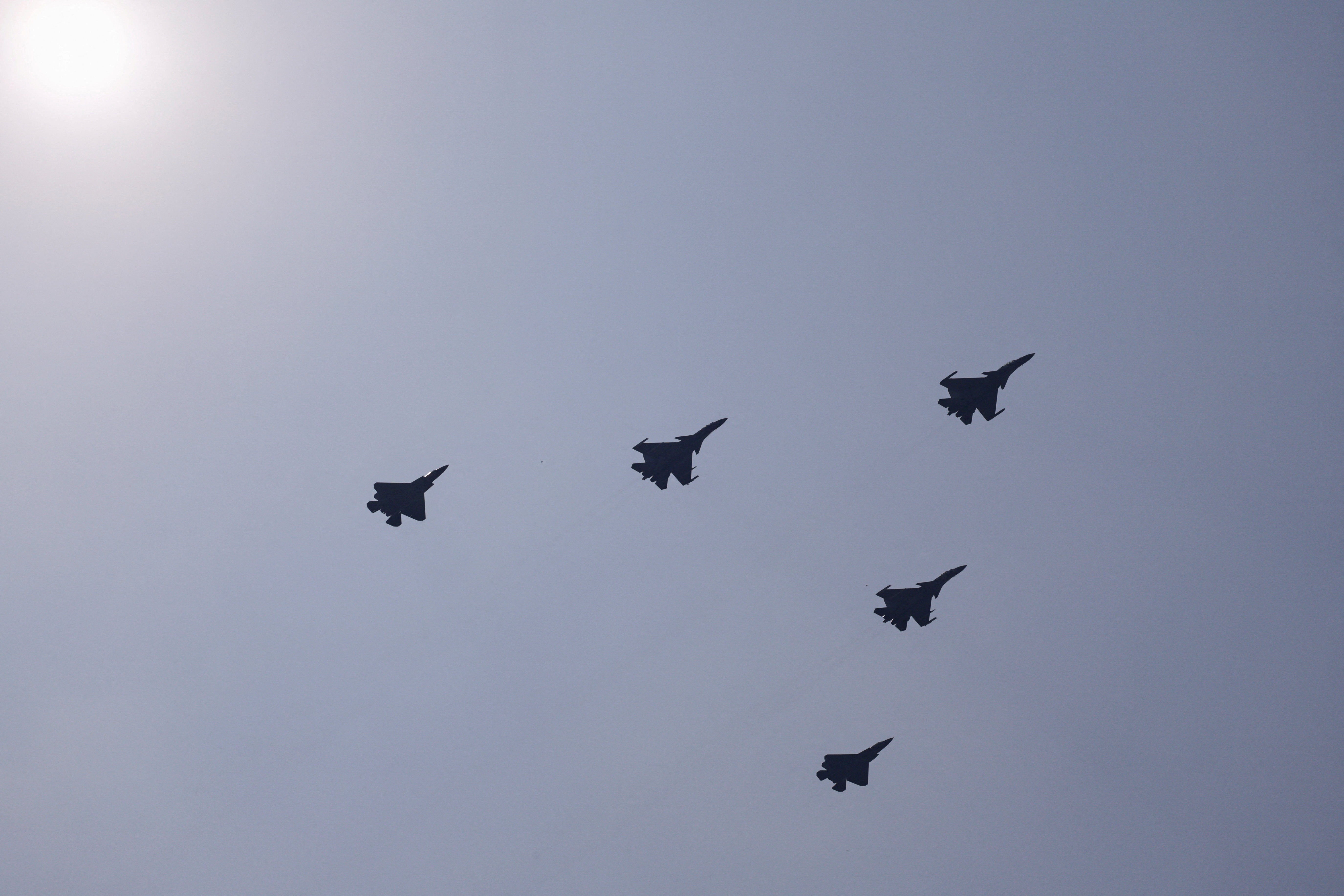 J-15DH, J-15T, J-35 fighter jets fly over Tiananmen Square during a military parade to mark the 80th anniversary of the end of World War Two, in Beijing, China, September 3, 2025. REUTERS/Tingshu Wang