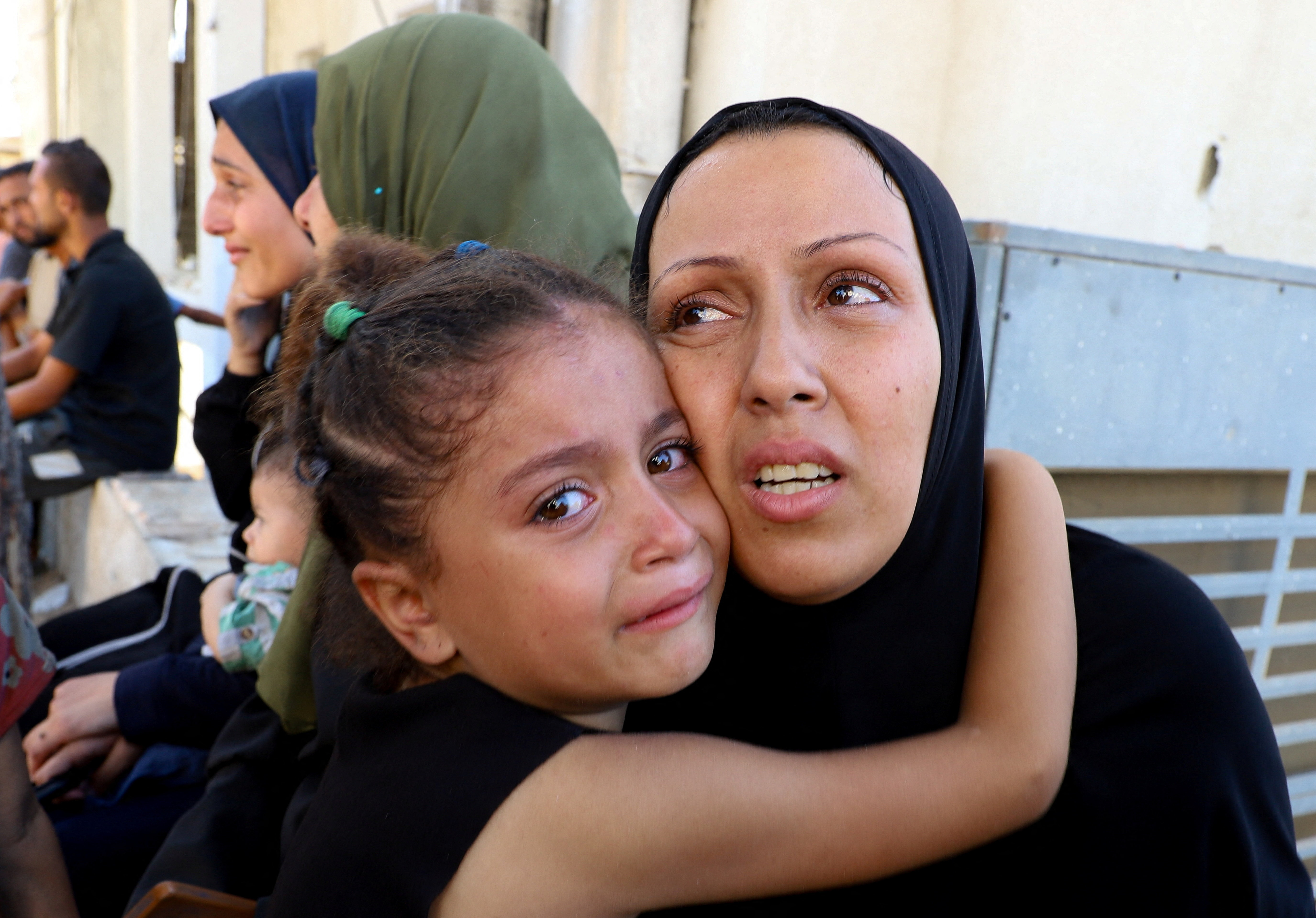 Mourners react during the funeral of Palestinians, who were killed today by Israeli fire while trying to receive aid, according to medics, at Al-Shifa Hospital in Gaza City, September 11, 2025. REUTERS/Ebrahim Hajjaj