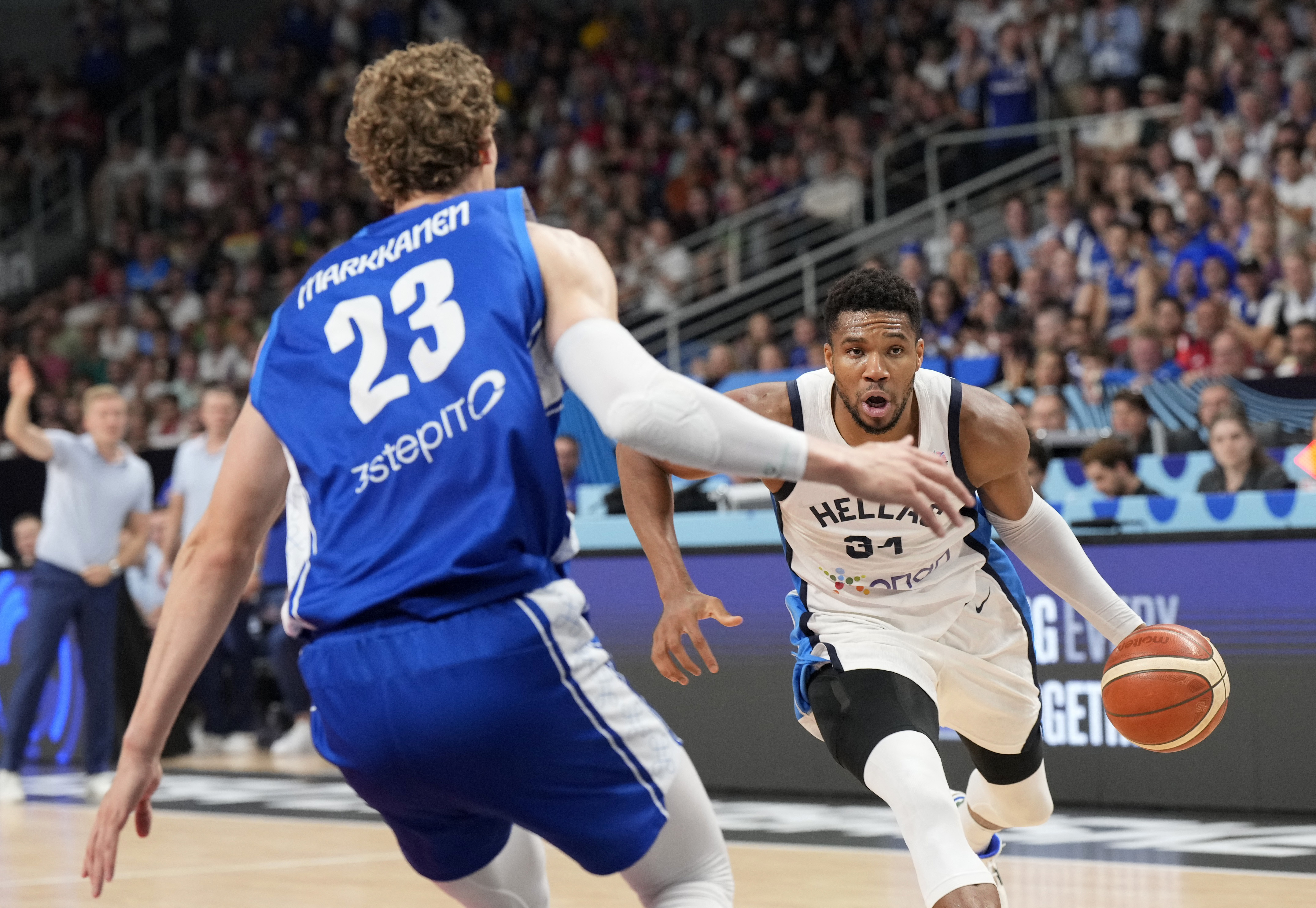 Basketball - FIBA EuroBasket 2025 - Third Place Game - Greece v Finland - Xiaomi Arena, Riga, Latvia - September 14, 2025 Greece's Giannis Antetokounmpo in action with Finland's Lauri Markkanen REUTERS/Ints Kalnins