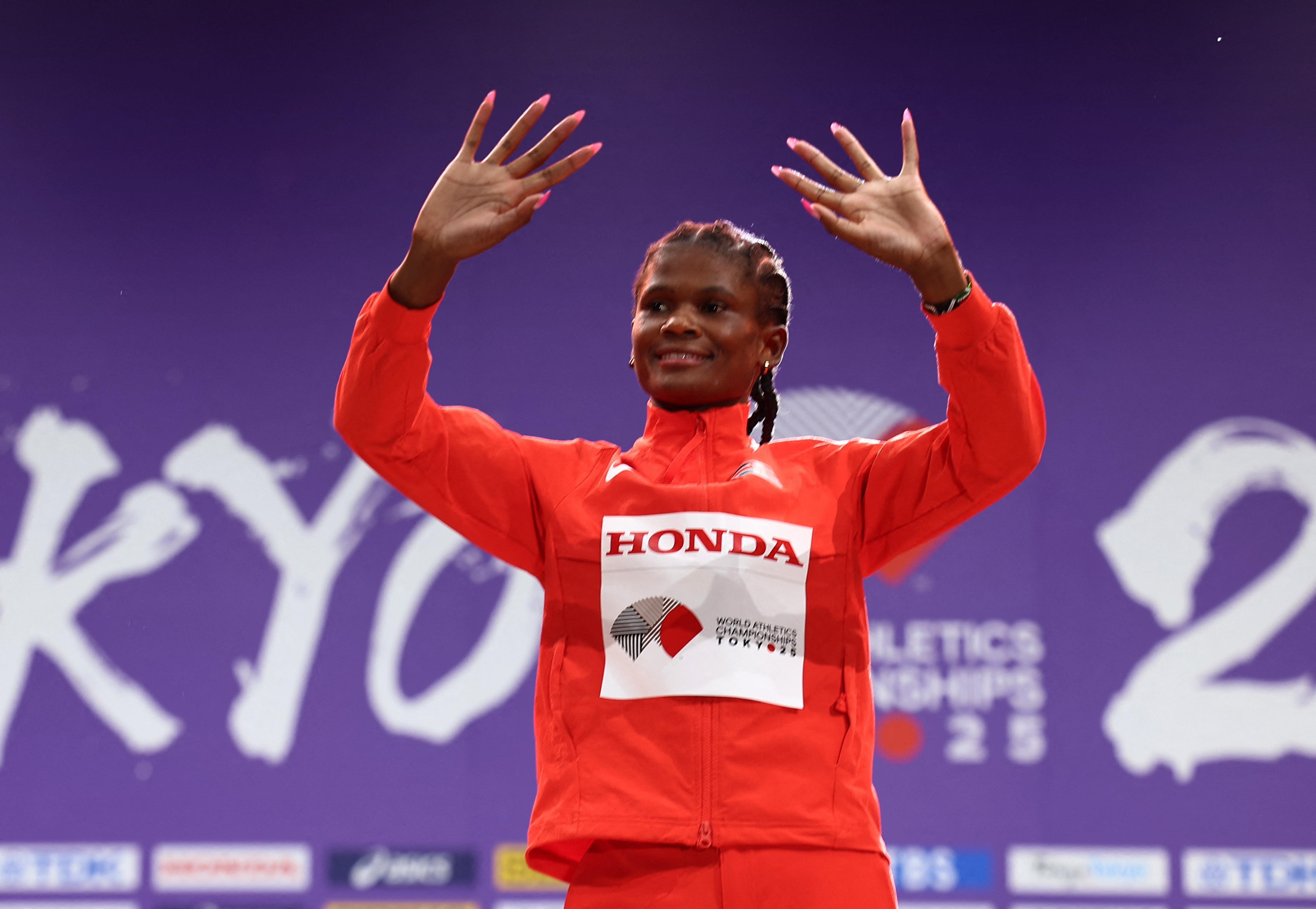 World Athletics Championships Tokyo 2025 - Women's 800m Medal Ceremony - Japan National Stadium, Tokyo, Japan - September 21, 2025 Gold medallist, Kenya's Lilian Odira celebrates on the podium REUTERS/Eloisa Lopez