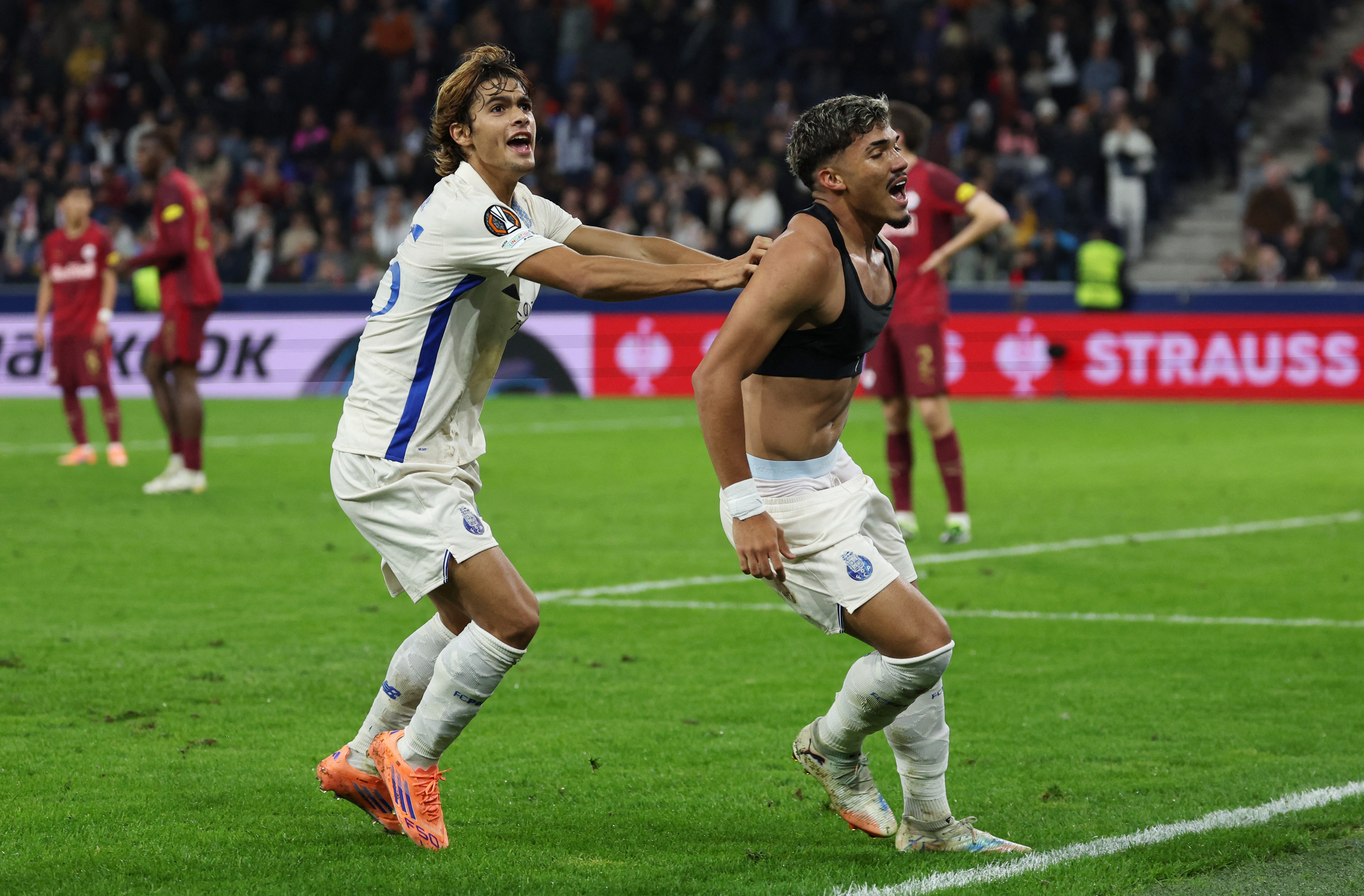 Soccer Football - UEFA Europa League - RB Salzburg v FC Porto - Red Bull Arena Salzburg, Salzburg, Austria - September 25, 2025 FC Porto's William Gomes celebrates scoring their first goal with Rodrigo Mora REUTERS/Gintare Karpaviciute
