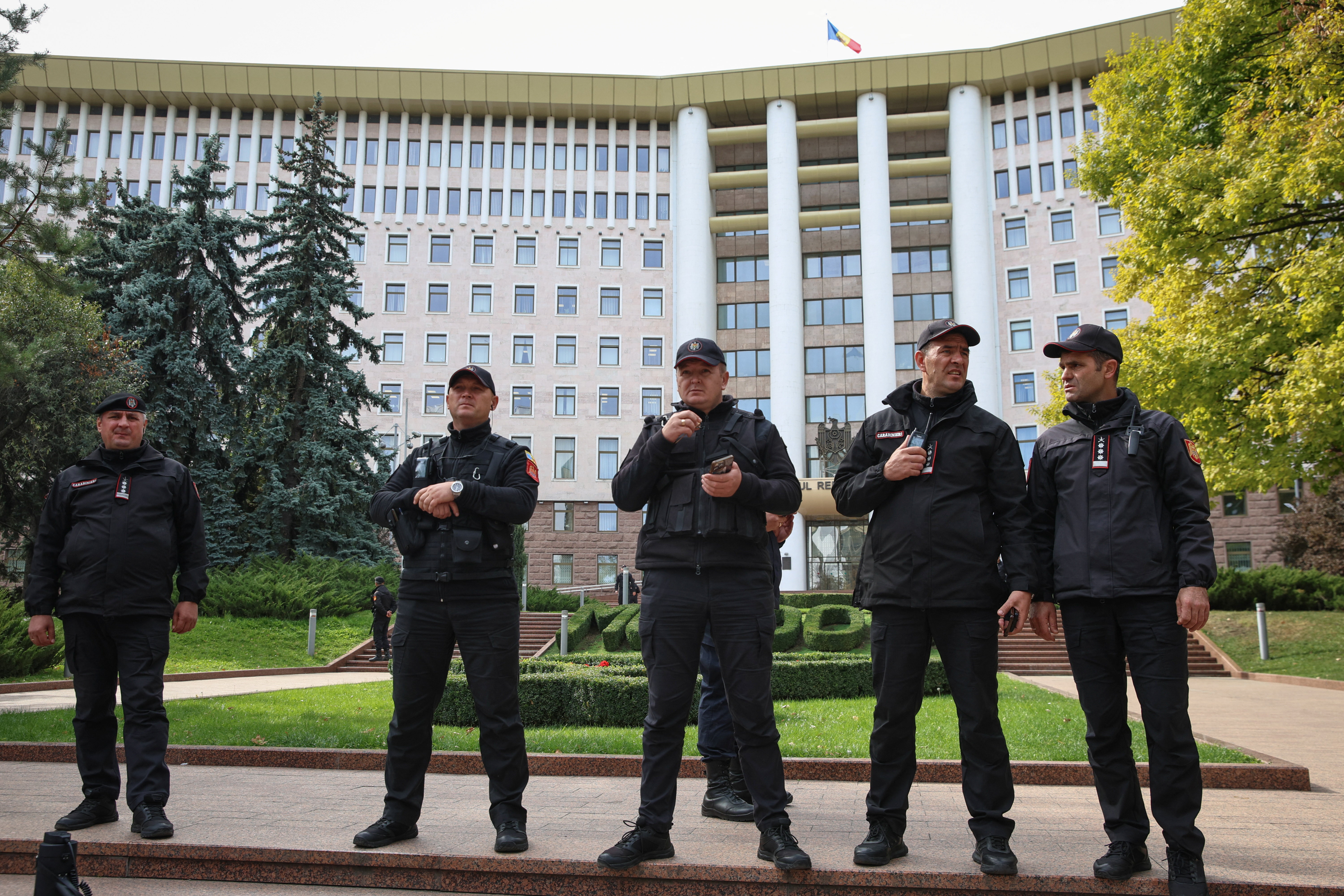 Police officers stand in front of the Parliament during a rally of opposition supporters following the announcement of parliamentary elections results, in Chisinau, Moldova September 29, 2025. REUTERS/Vladislav Culiomza