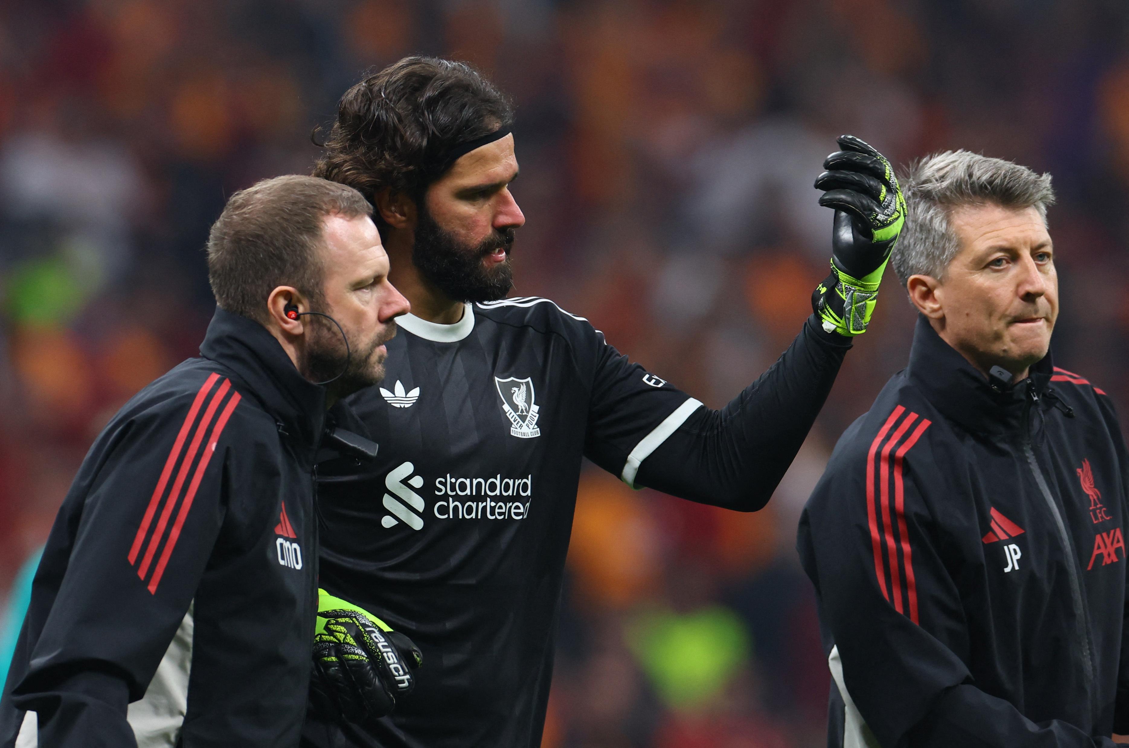 Soccer Football - UEFA Champions League - Galatasaray v Liverpool - Rams Park, Istanbul, Turkey - September 30, 2025 Liverpool's Alisson Becker receives medical attention after sustaining an injury REUTERS/Murad Sezer