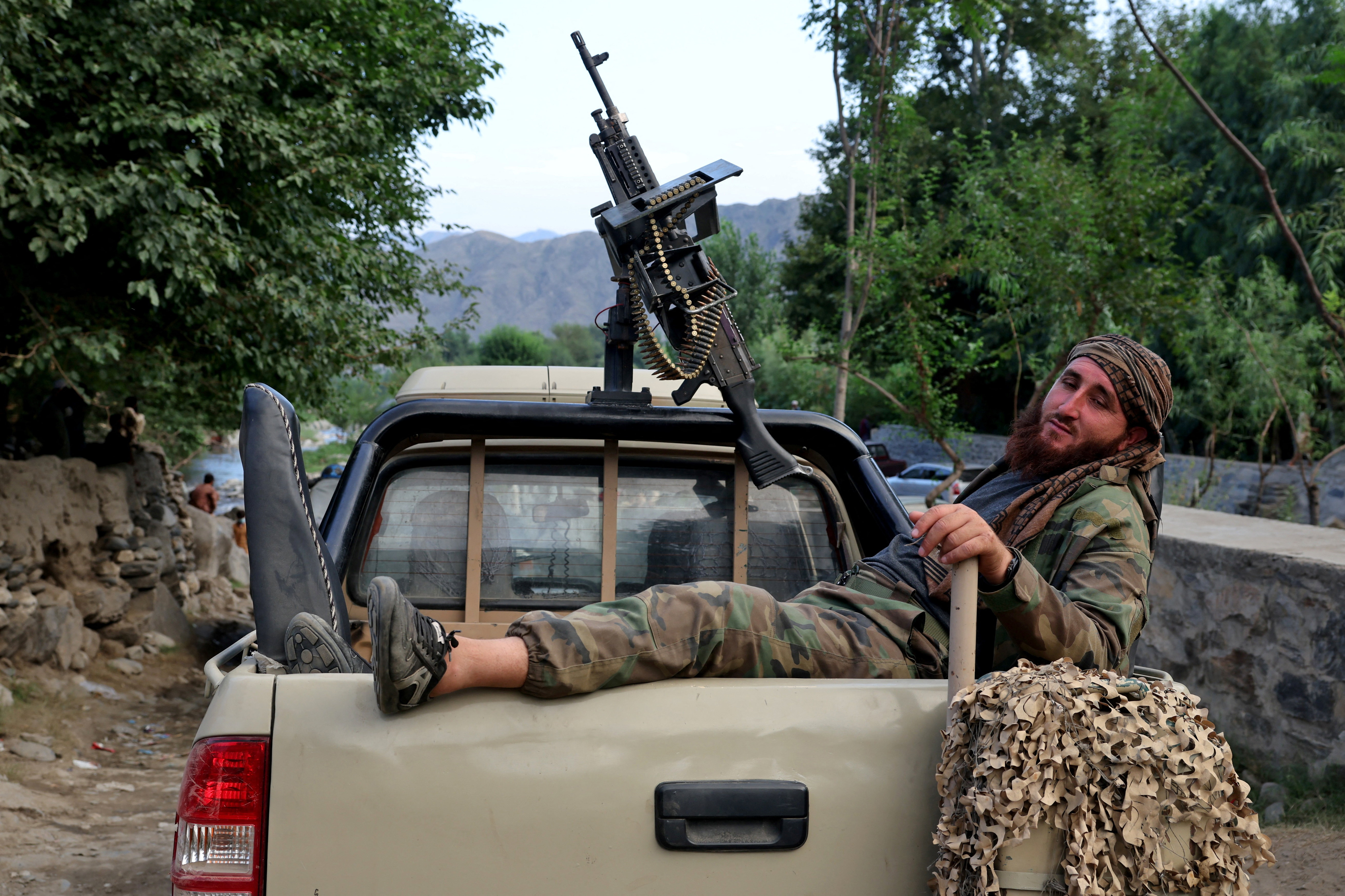 A member of the Taliban rests in a vehicle in a quake-hit area following a deadly earthquake that struck Afghanistan's Kunar and Nangarhar provinces, in Nurgal district, Kunar province, Afghanistan, September 4, 2025. REUTERS/Sayed Hassib