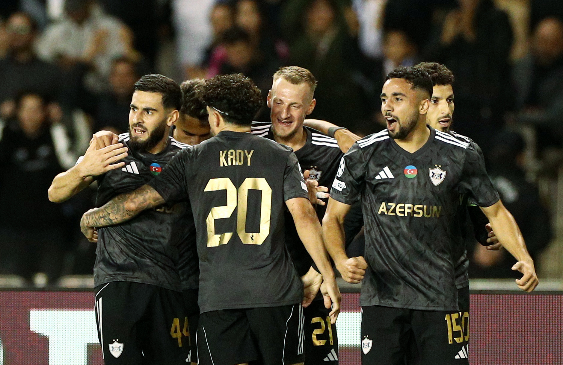 Soccer Football - UEFA Champions League - Qarabag v FC Copenhagen - Tofiq Bahramov Stadium, Baku, Azerbaijan - October 1, 2025 Qarabag's Abdellah Zoubir celebrates scoring their first goal with teammates REUTERS/Aziz Karimov