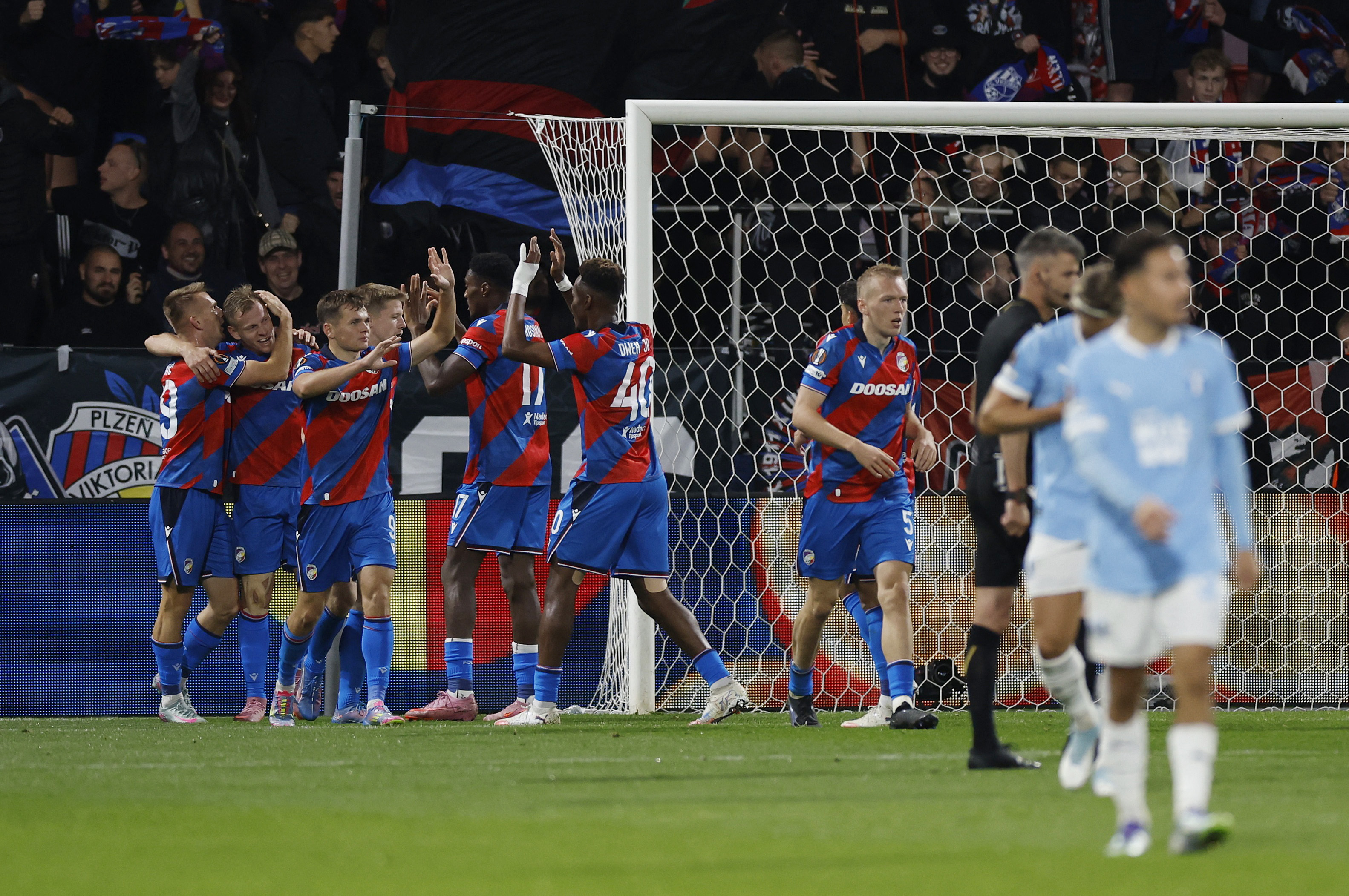 Soccer Football - UEFA Europa League - Viktoria Plzen v Malmo FF - Doosan Arena, Plzen, Czech Republic - October 2, 2025 Viktoria Plzen's Matej Vydra celebrates scoring their first goal with teammates REUTERS/David W Cerny