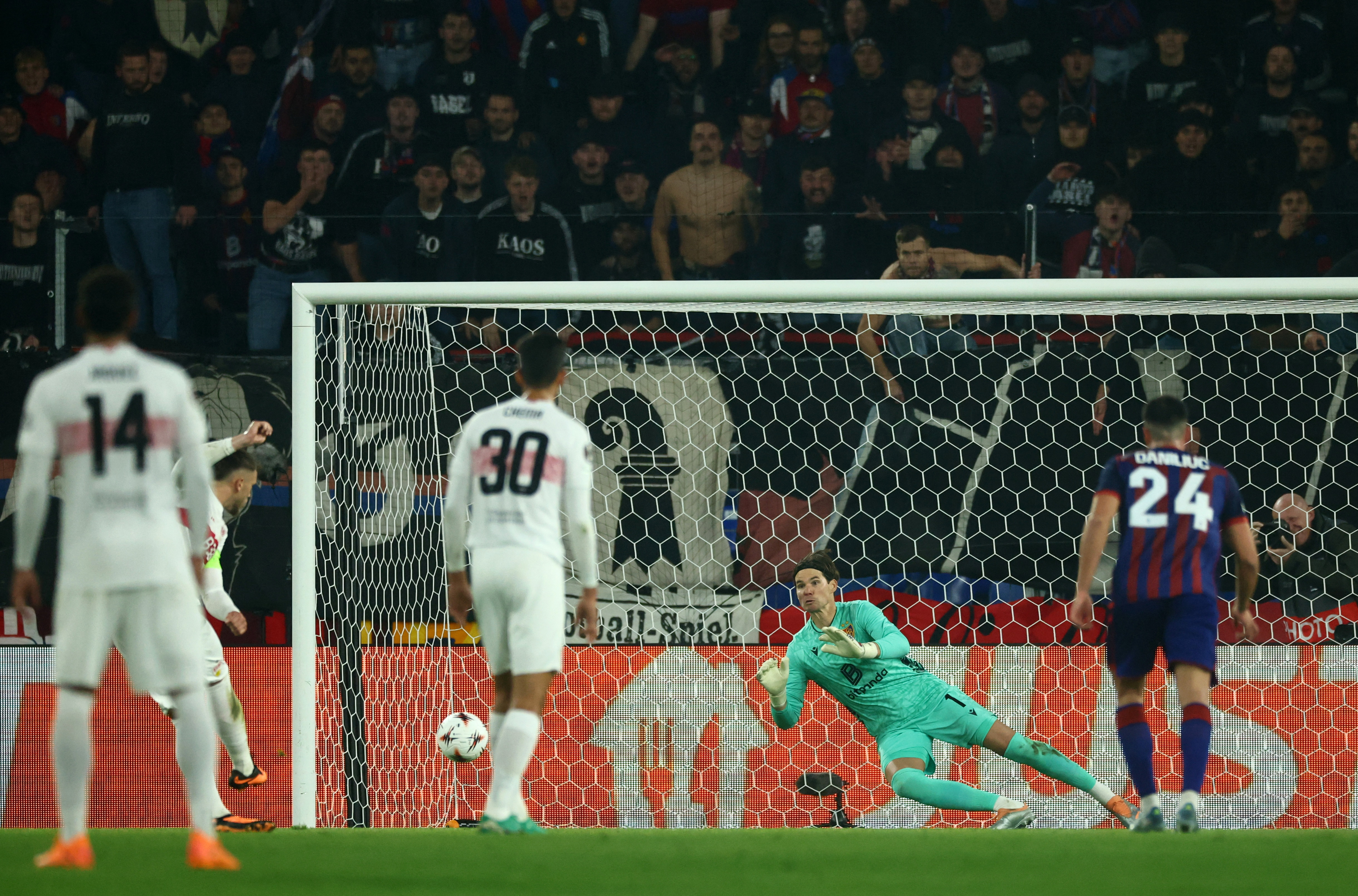 Soccer Football - UEFA Europa League - Basel v VfB Stuttgart - St. Jakob-Park, Basel, Switzerland - October 2, 2025 Basel's Marwin Hitz saves a penalty from VfB Stuttgart's Ermedin Demirovic REUTERS/Denis Balibouse