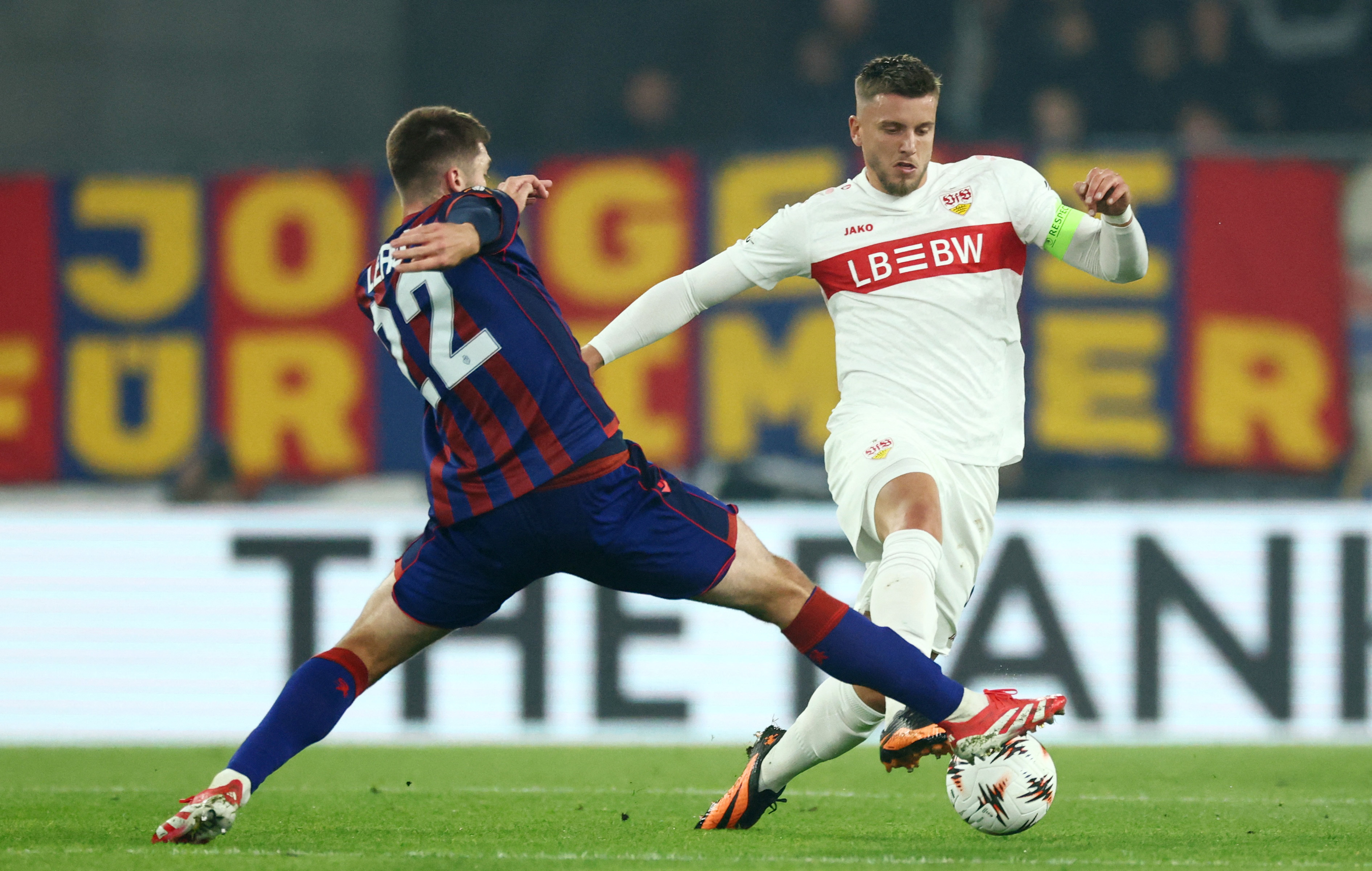 Soccer Football - UEFA Europa League - Basel v VfB Stuttgart - St. Jakob-Park, Basel, Switzerland - October 2, 2025 VfB Stuttgart's Ermedin Demirovic in action with Basel's Leo Leroy REUTERS/Denis Balibouse