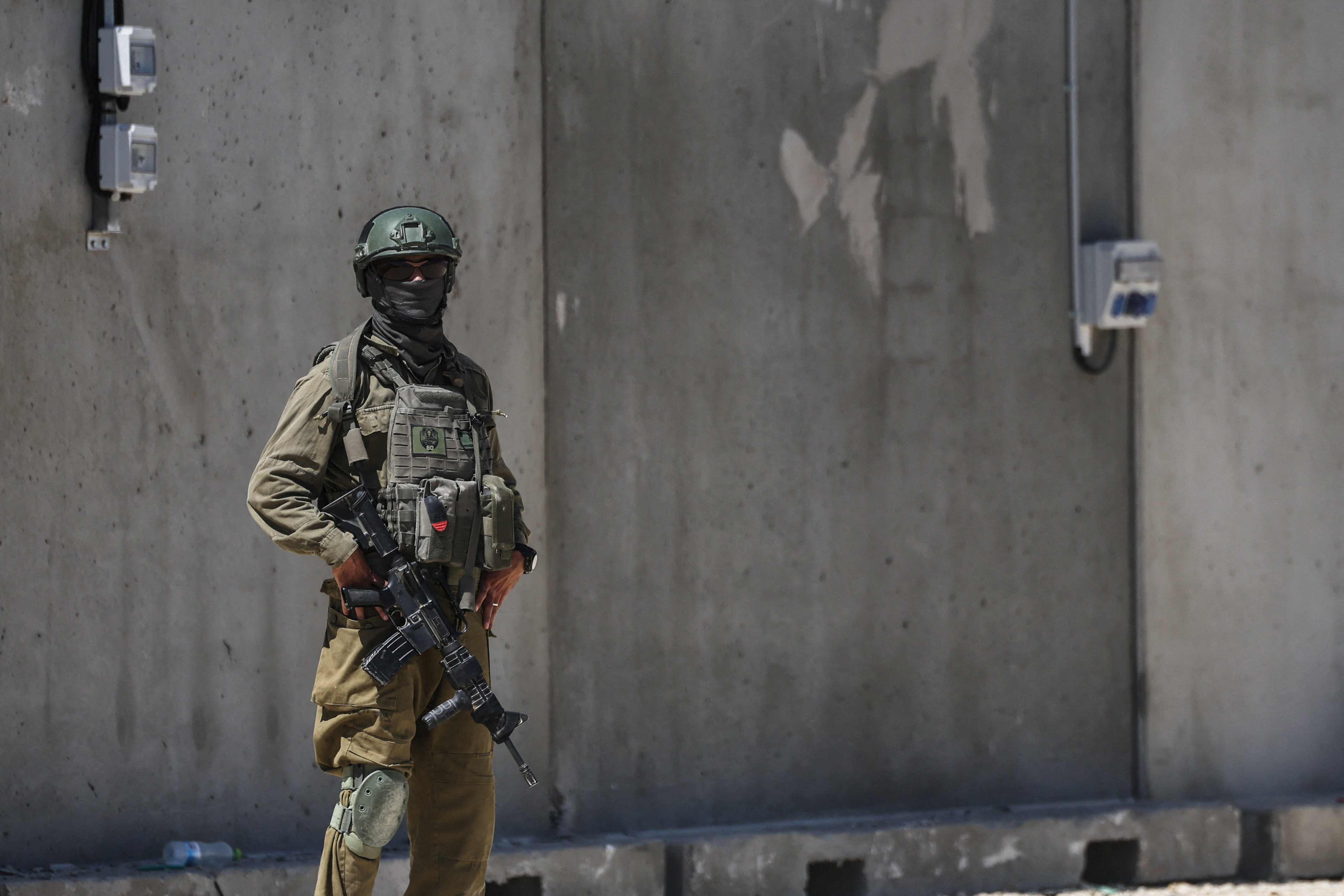 An Israeli soldier stands by during preparations for the opening of a new U
