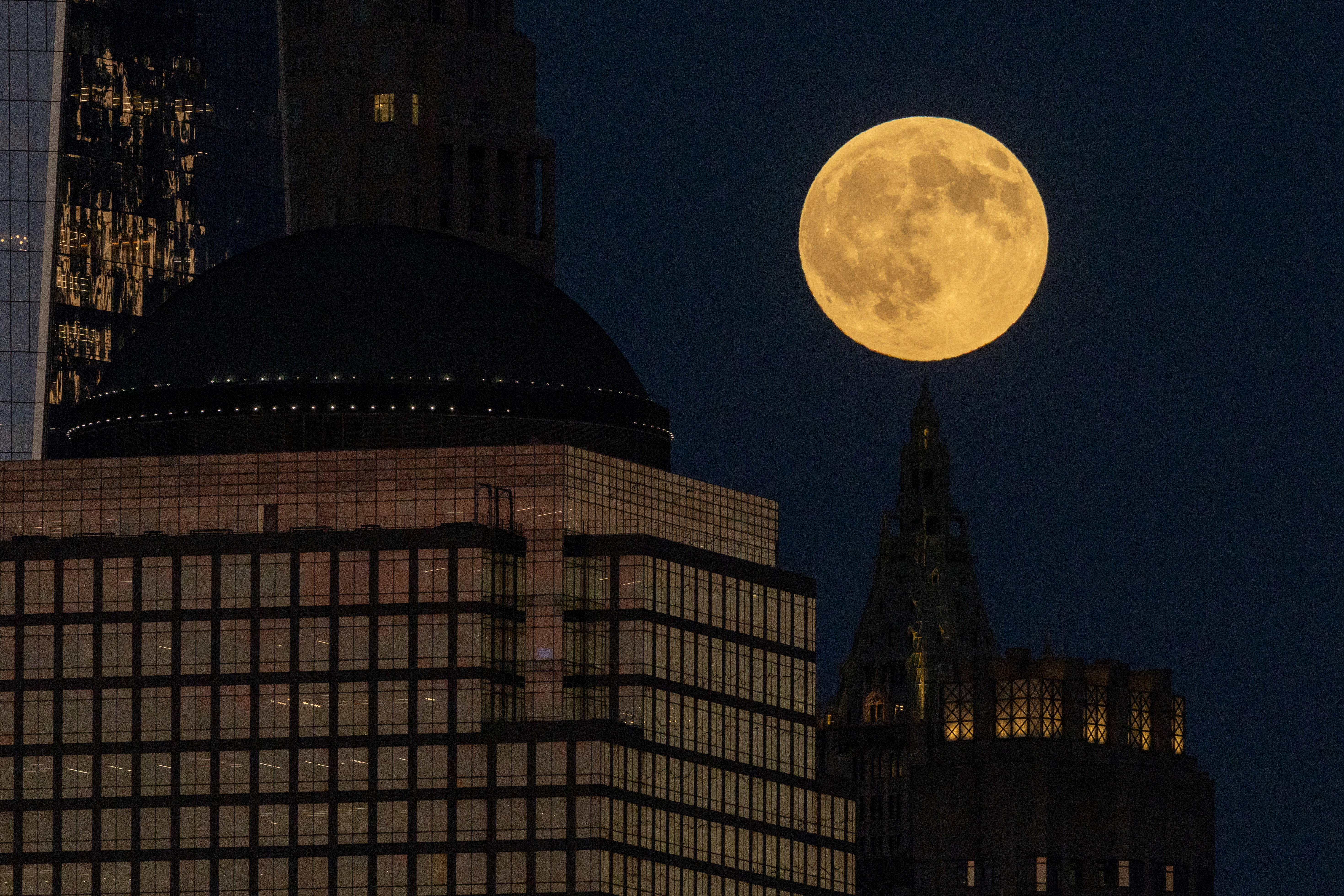 The first supermoon of the year, known as the Harvest Moon, rises above lower Manhattan, as seen from Jersey City, New Jersey, U.S., October 6, 2025. REUTERS/Kylie Cooper