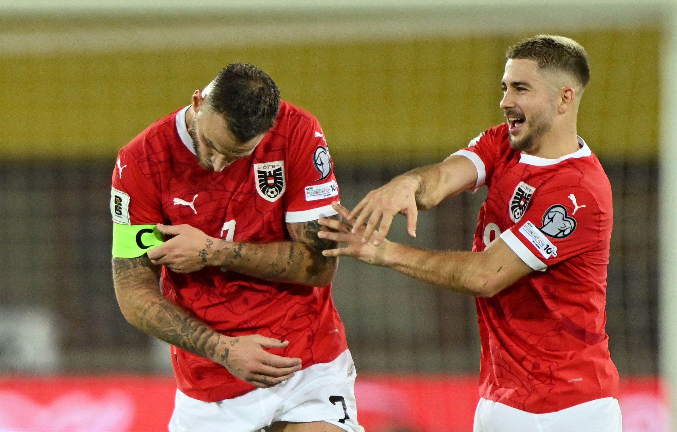 Soccer Football - FIFA World Cup - UEFA Qualifiers - Group H - Austria v San Marino - Ernst Happel Stadion, Vienna, Austria - October 9, 2025 Austria's Marko Arnautovic celebrates scoring their ninth goal with Romano Schmid REUTERS/Elisabeth Mandl