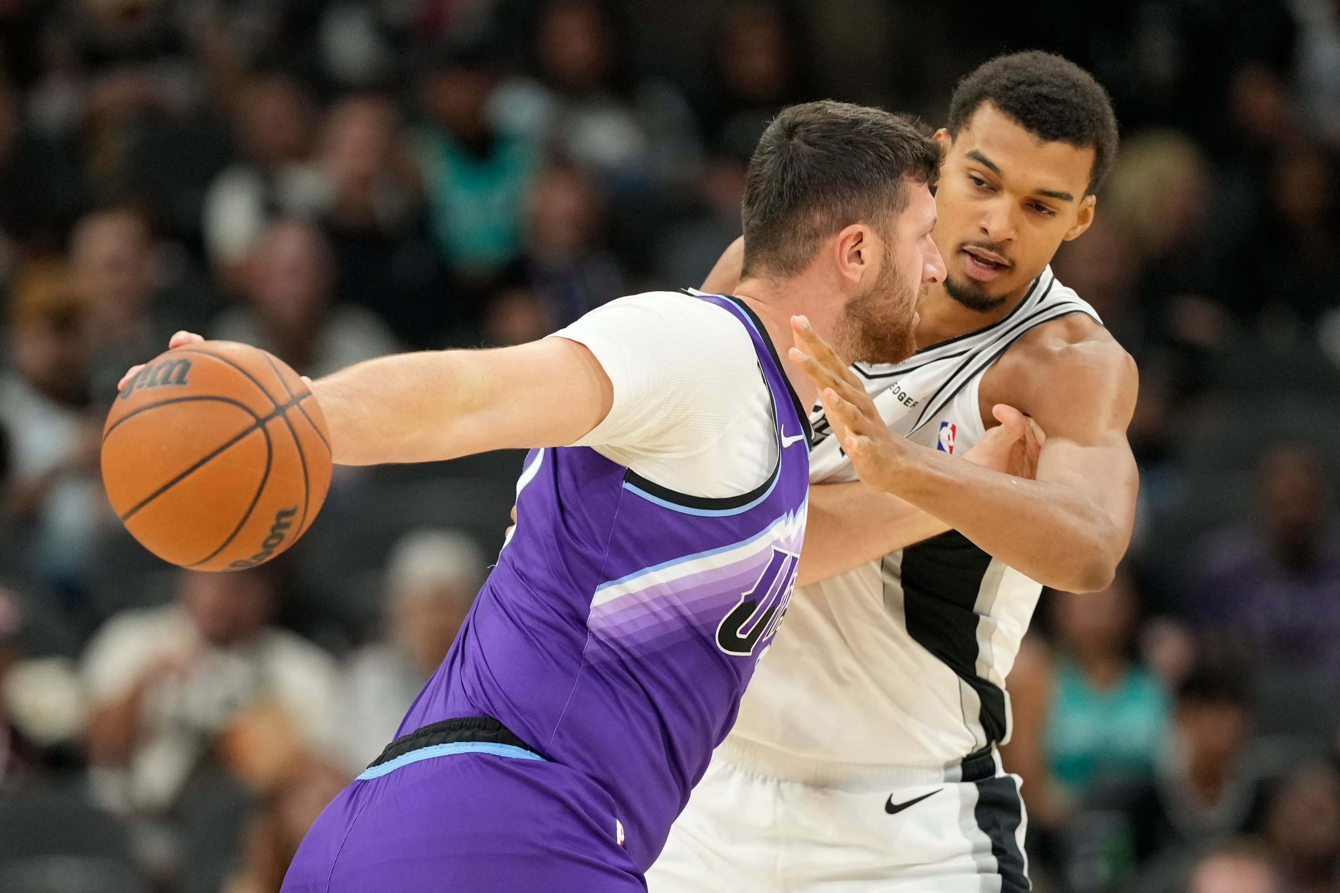 Oct 10, 2025; San Antonio, Texas, USA; San Antonio Spurs forward Victor Wembanyama (1) defends Utah Jazz center Jusuf Nurkic (30) during the first half at Frost Bank Center. Mandatory Credit: Scott Wachter-Imagn Images