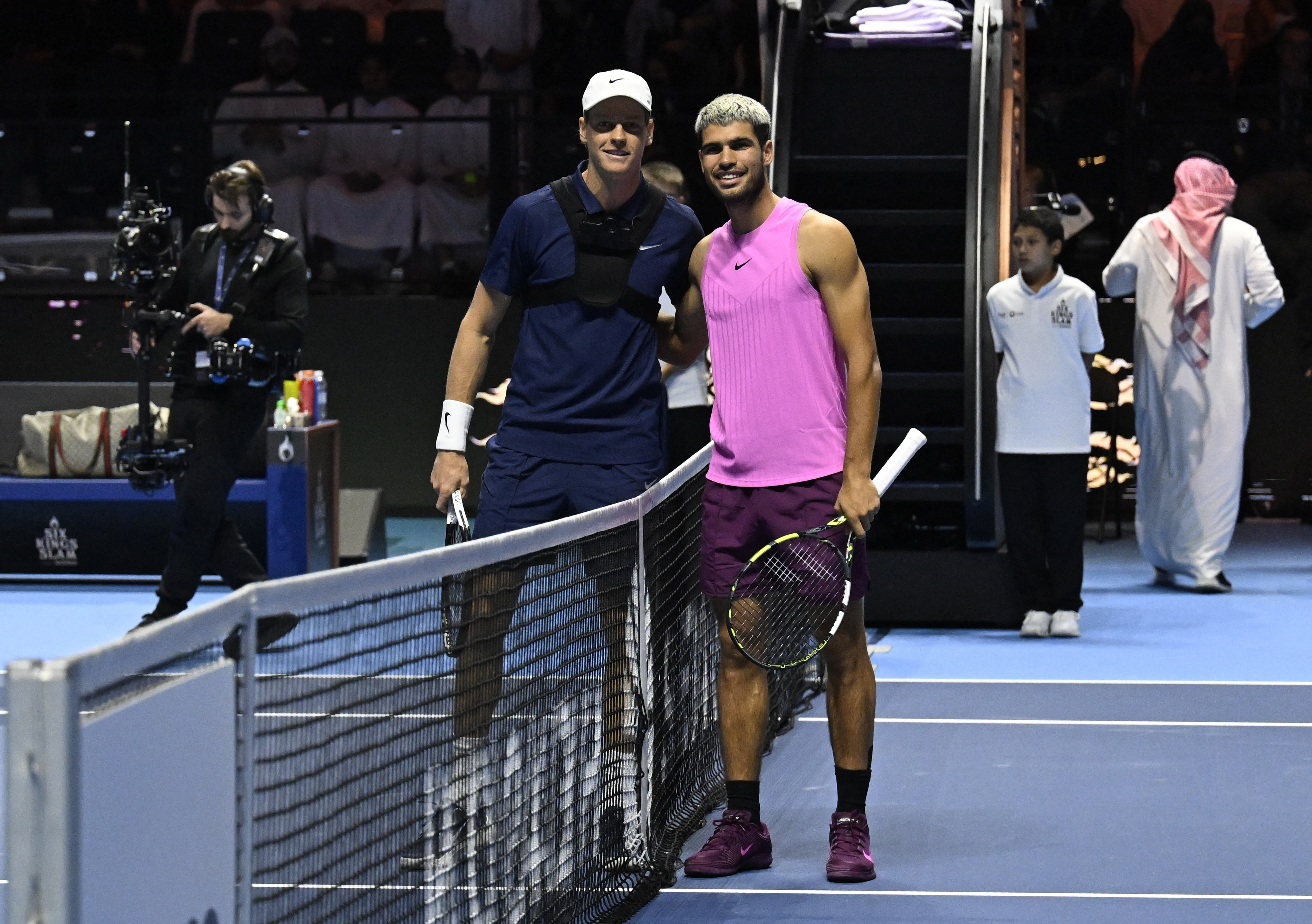 Tennis - Six Kings Slam - ANB Arena, Riyadh, Saudi Arabia - October 18, 2025 Italy's Jannik Sinner and Spain's Carlos Alcaraz pose ahead of the final match REUTERS/Stringer