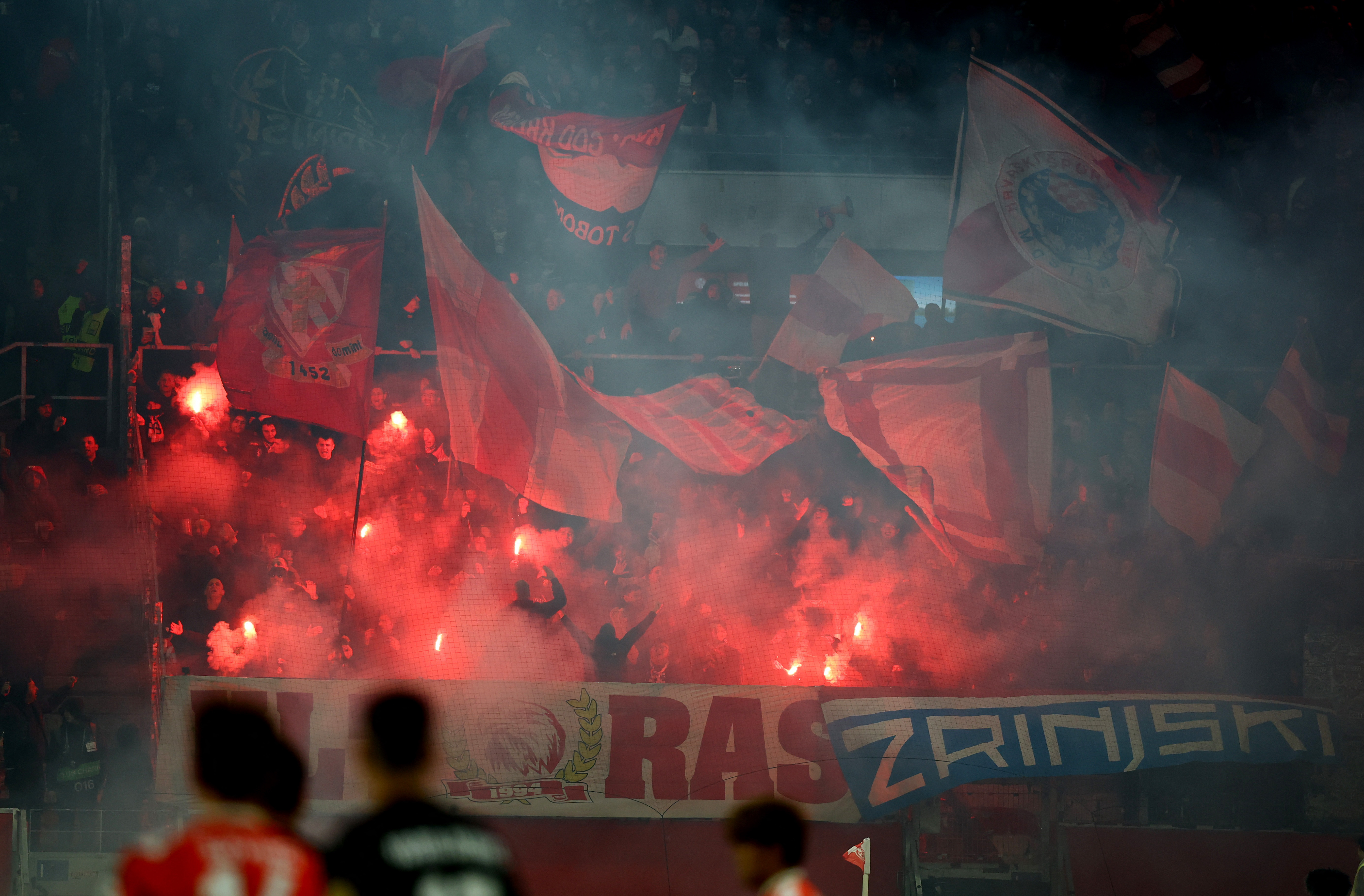 Soccer Football - UEFA Conference League - 1. FSV Mainz 05 v Zrinjski Mostar - MEWA Arena, Mainz, Germany - October 23, 2025 Zrinjski Mostar fans with flares in the stands REUTERS/Kai Pfaffenbach