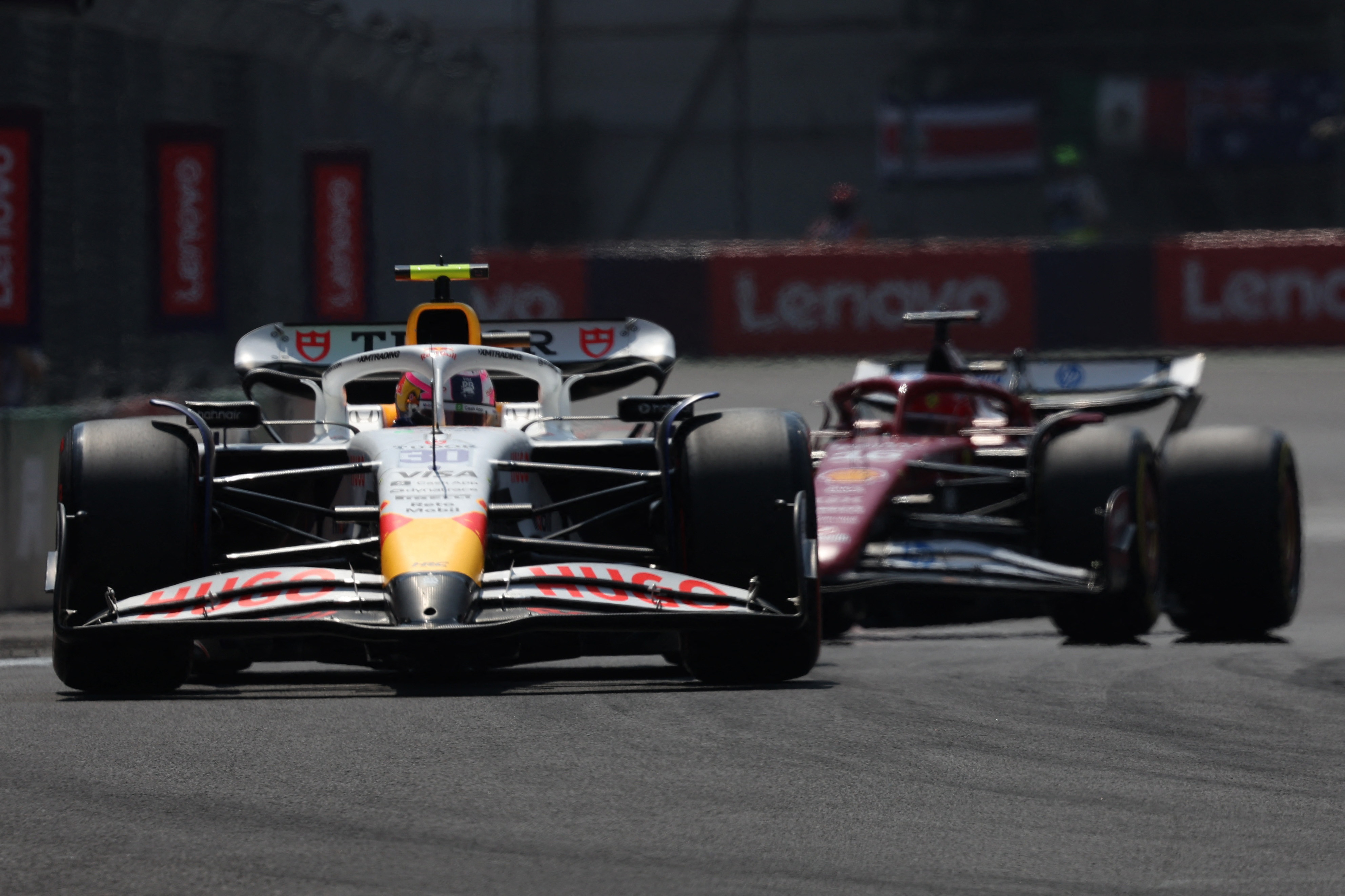 Formula One F1 - Mexico Grand Prix - Autodromo Hermanos Rodriguez, Mexico City, Mexico - October 25, 2025 RB's Liam Lawson and Ferrari's Charles Leclerc during practice REUTERS/Henry Romero