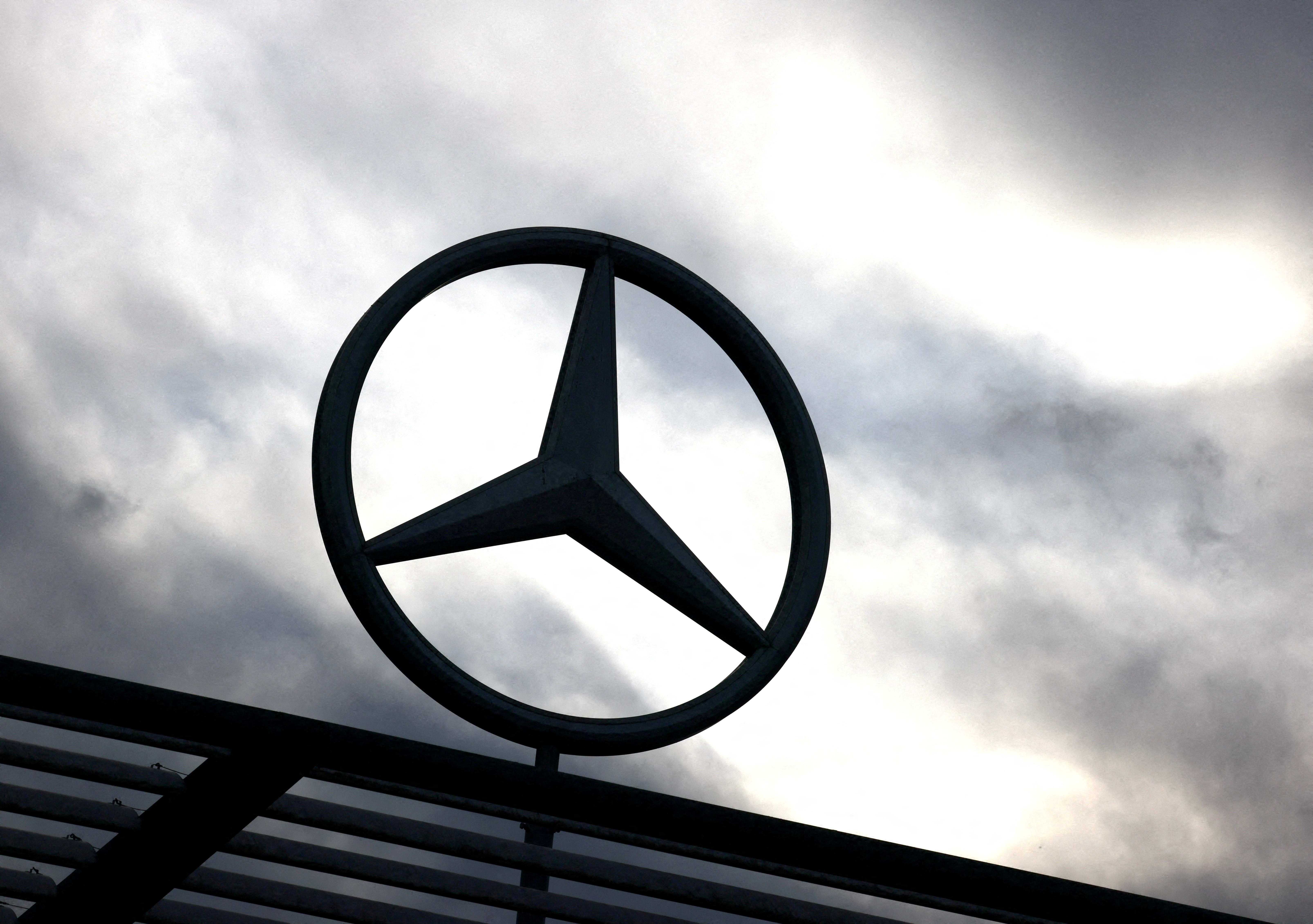 FILE PHOTO: A logo of the Mercedes-Benz is seen outside a Mercedes-Benz car dealer in Brussels, Belgium March 13, 2023. REUTERS/Yves Herman/File Photo