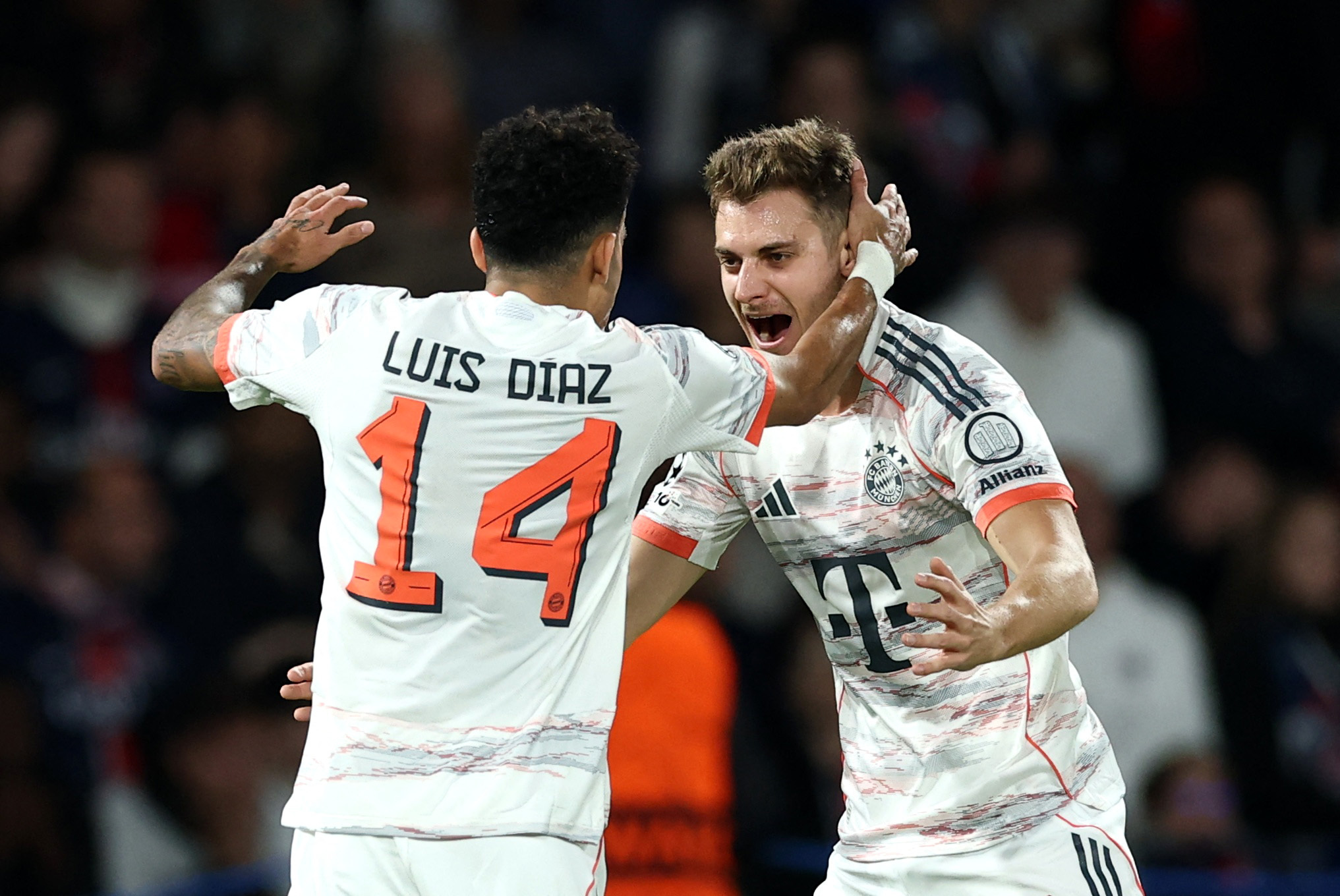 Soccer Football - UEFA Champions League - Paris St Germain v Bayern Munich - Parc des Princes, Paris, France - November 4, 2025 Bayern Munich's Luis Diaz celebrates scoring their second goal with Josip Stanisic REUTERS/Gonzalo Fuentes