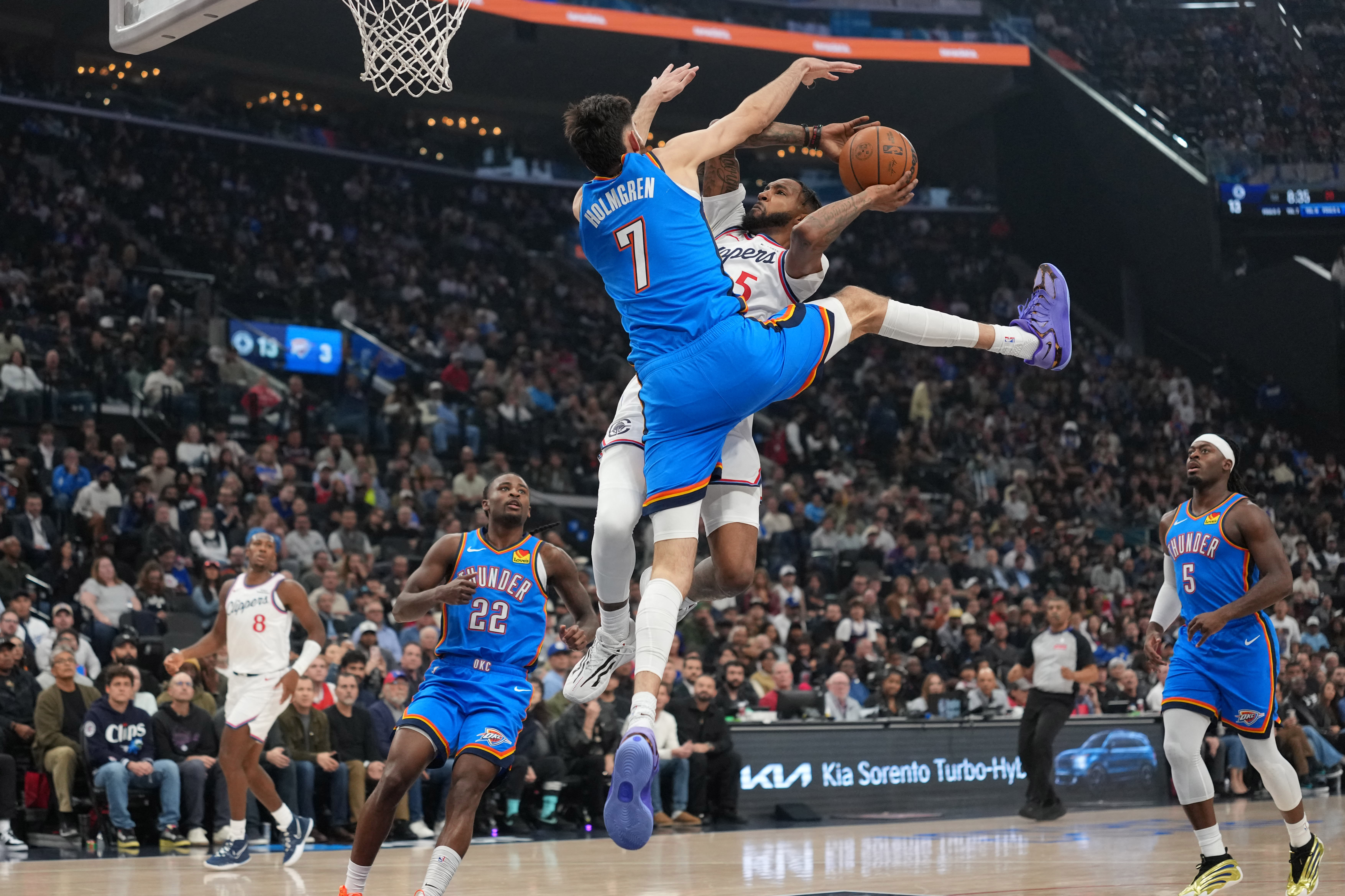OKlahoma Derrick Jones Jr. (5) shoots the ball against Oklahoma City Thunder center Chet Holmgren (7)