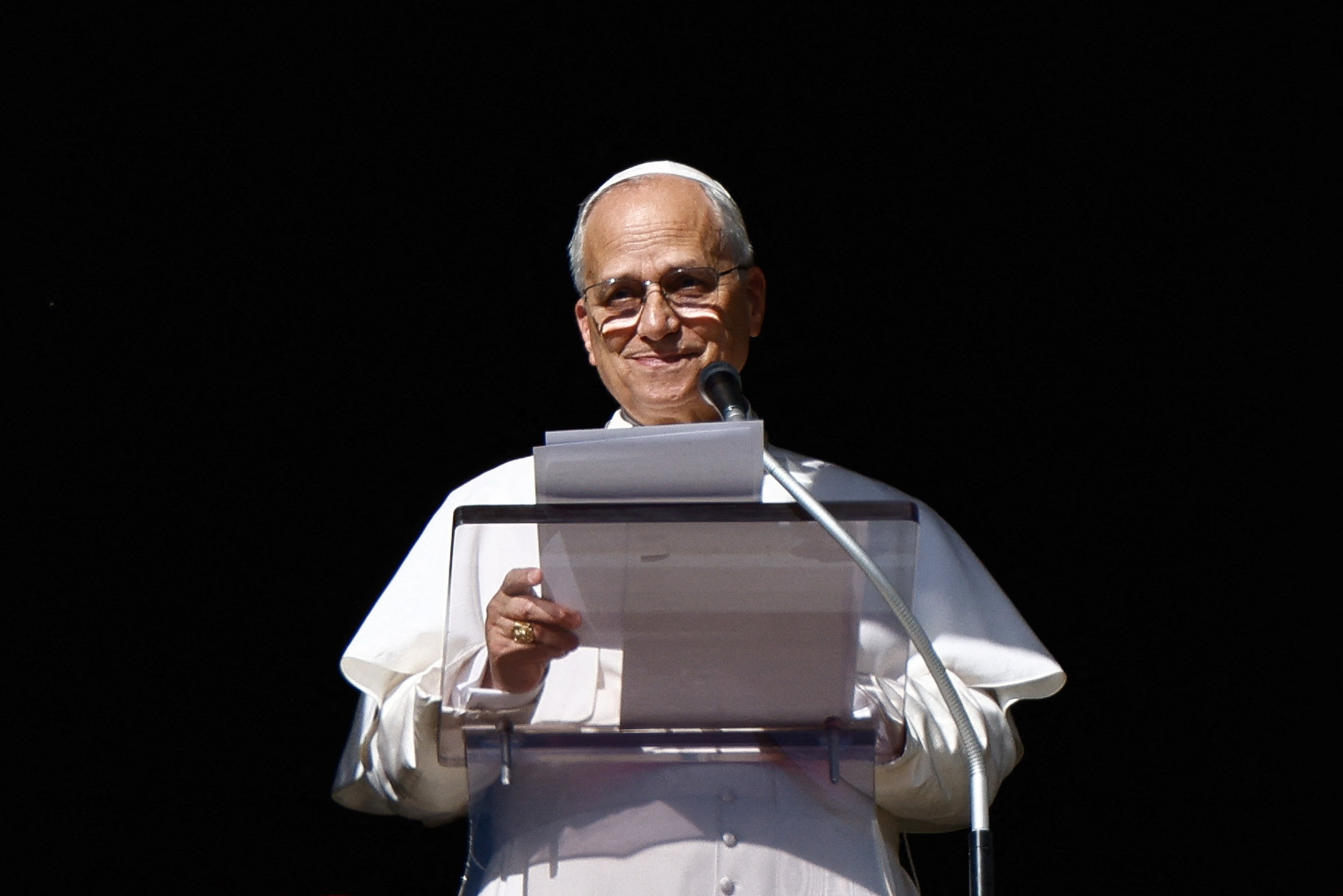Pope Leo XIV leads the Angelus prayer from the window of the Apostolic Palace at the Vatican