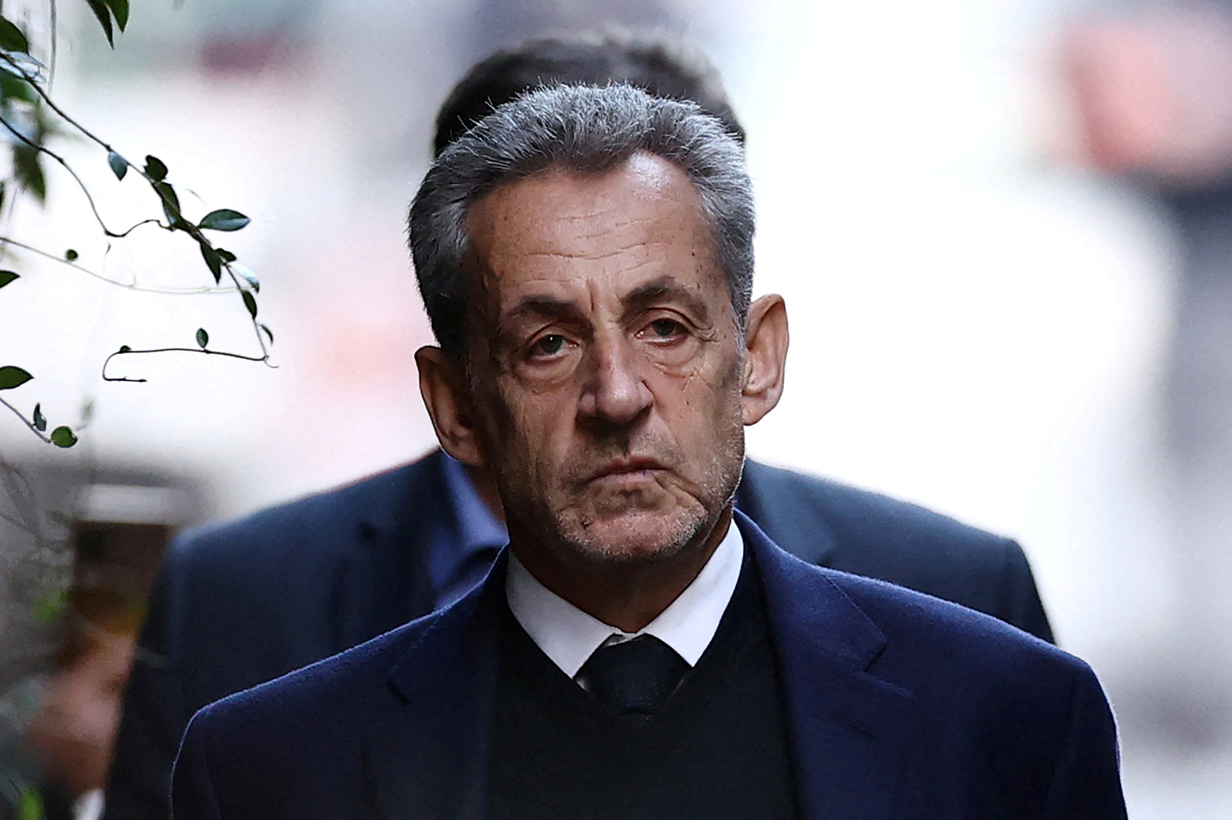 FILE PHOTO: Former French president Nicolas Sarkozy leaves his house on the day of his incarceration at the Sante prison to begin his five-year prison sentence for criminal conspiracy over attempts to raise campaign funds from Libya