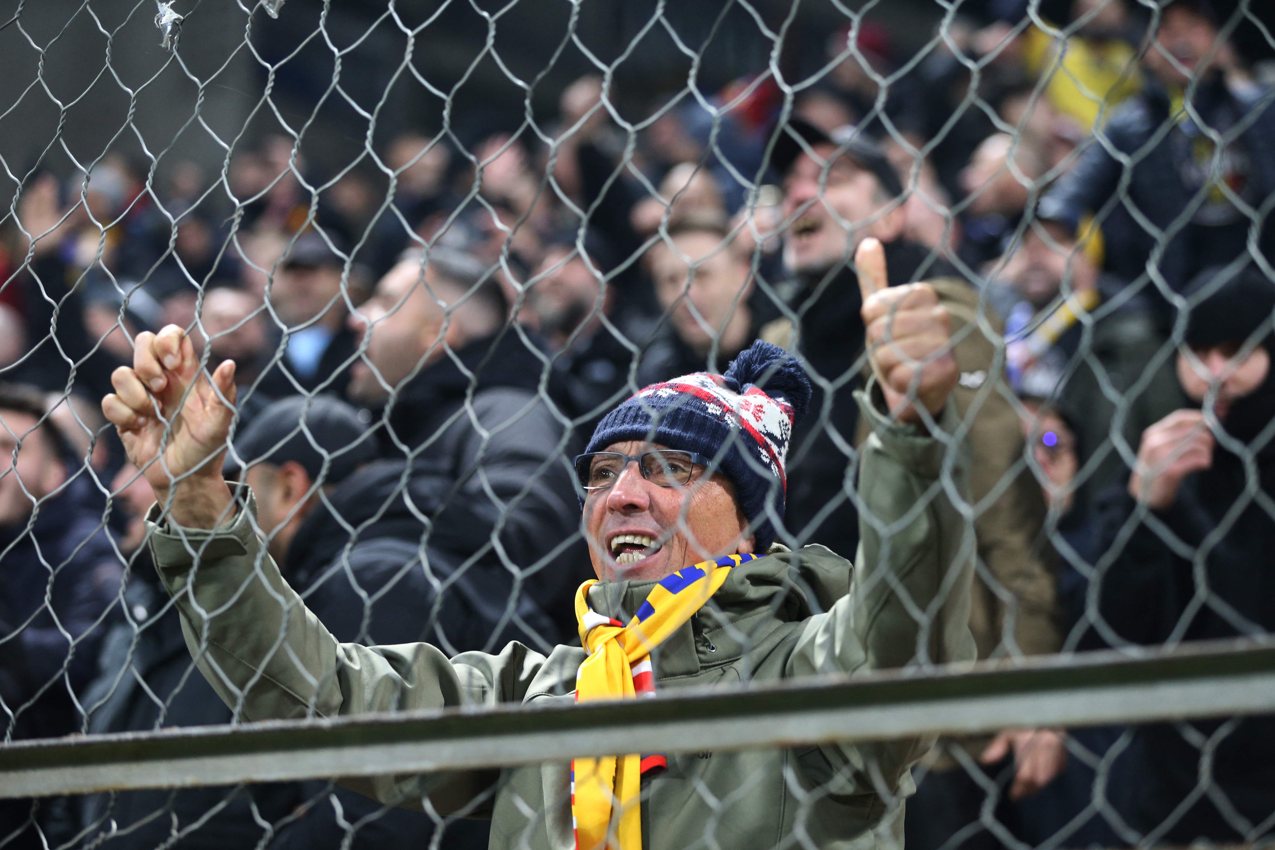 Soccer Football - FIFA World Cup - UEFA Qualifiers - Group H - Bosnia and Herzegovina v Romania - Stadion Bilino Polje, Zenica, Bosnia and Herzegovina - November 15, 2025 Romania fans celebrate their first goal scored by Daniel Birligea REUTERS/Amel Emric