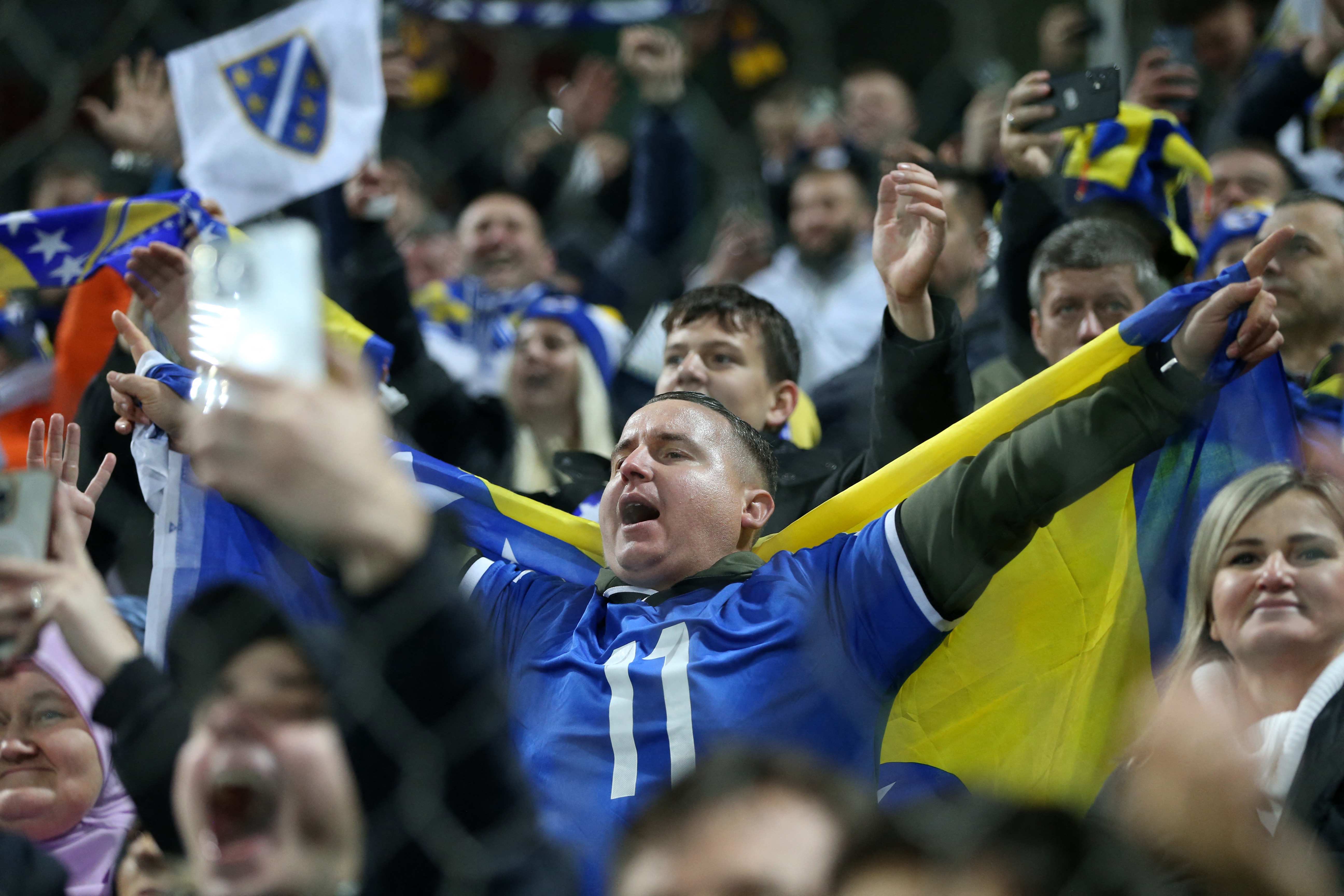 Soccer Football - FIFA World Cup - UEFA Qualifiers - Group H - Bosnia and Herzegovina v Romania - Stadion Bilino Polje, Zenica, Bosnia and Herzegovina - November 15, 2025 Bosnia and Herzegovina fans celebrate after the match REUTERS/Amel Emric