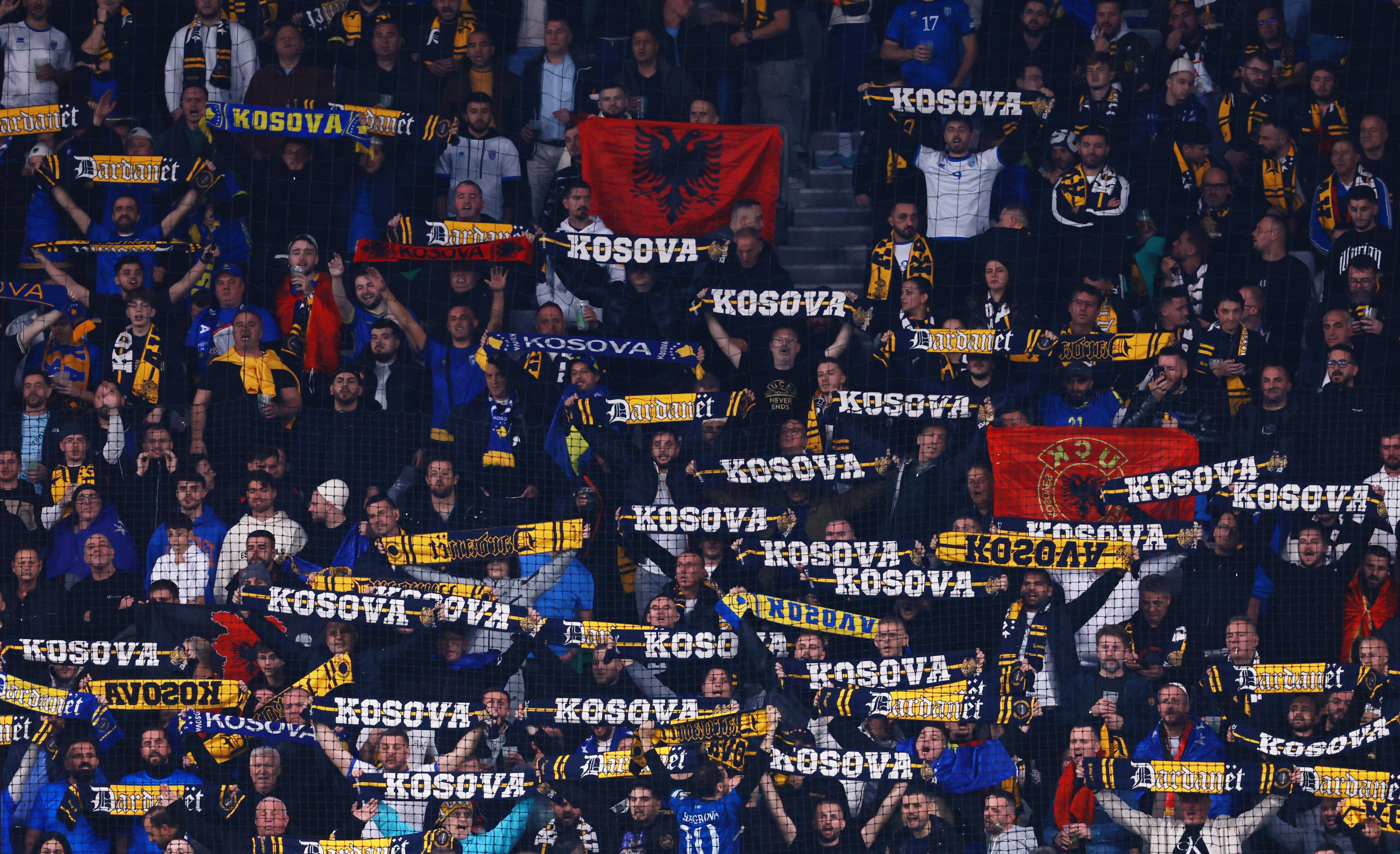 Soccer Football - FIFA World Cup - UEFA Qualifiers - Group B - Slovenia v Kosovo - Stadion Stozice, Ljubljana, Slovenia - November 15, 2025 Kosovo fans are pictured with banners and flags inside the stadium REUTERS/Borut Zivulovic