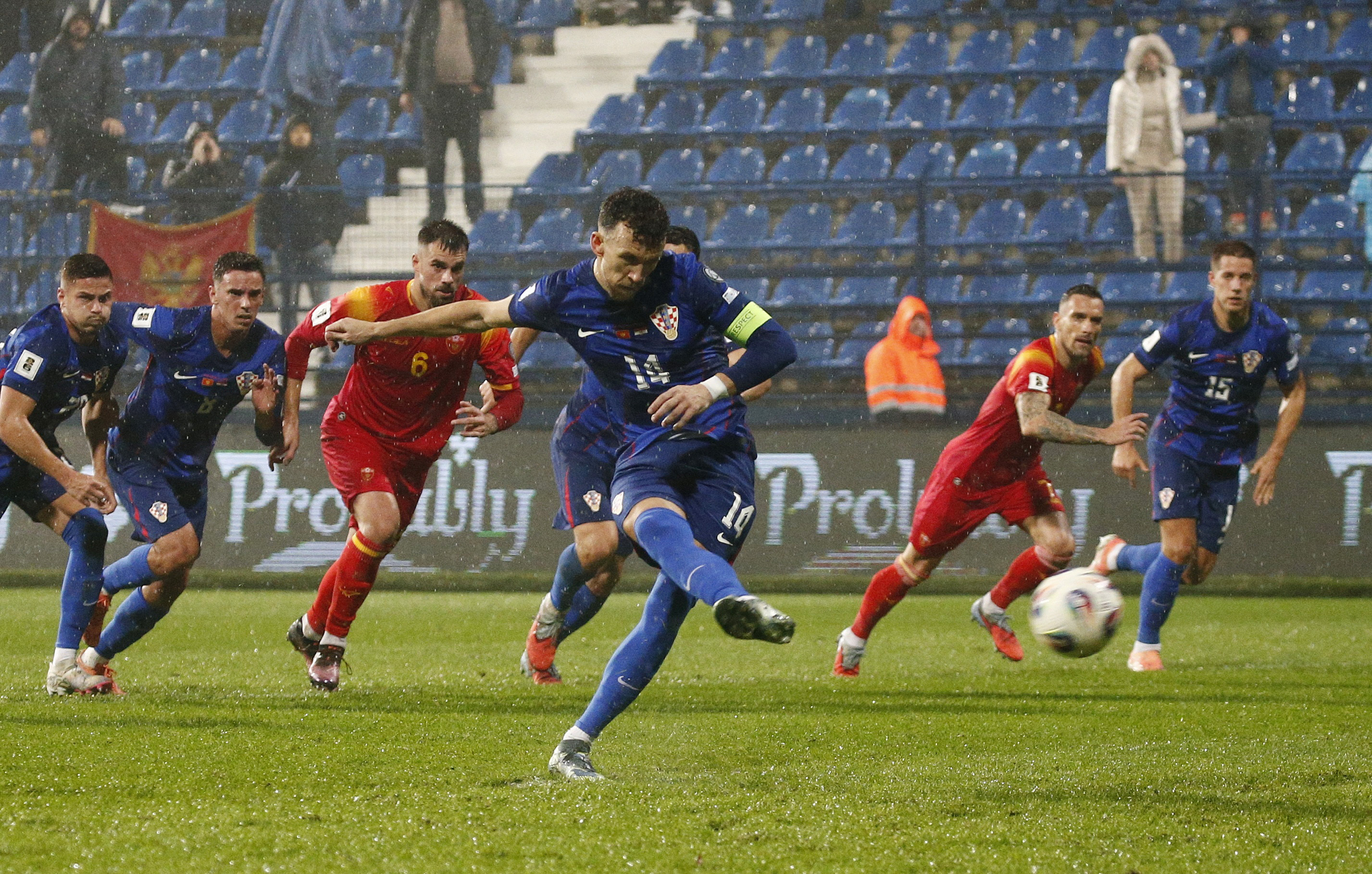 Soccer Football - World Cup - UEFA Qualifiers - Group L - Montenegro v Croatia - Podgorica City Stadium, Podgorica, Montenegro - November 17, 2025 Croatia's Ivan Perisic scores their first goal from the penalty spot REUTERS/Stevo Vasiljevic
