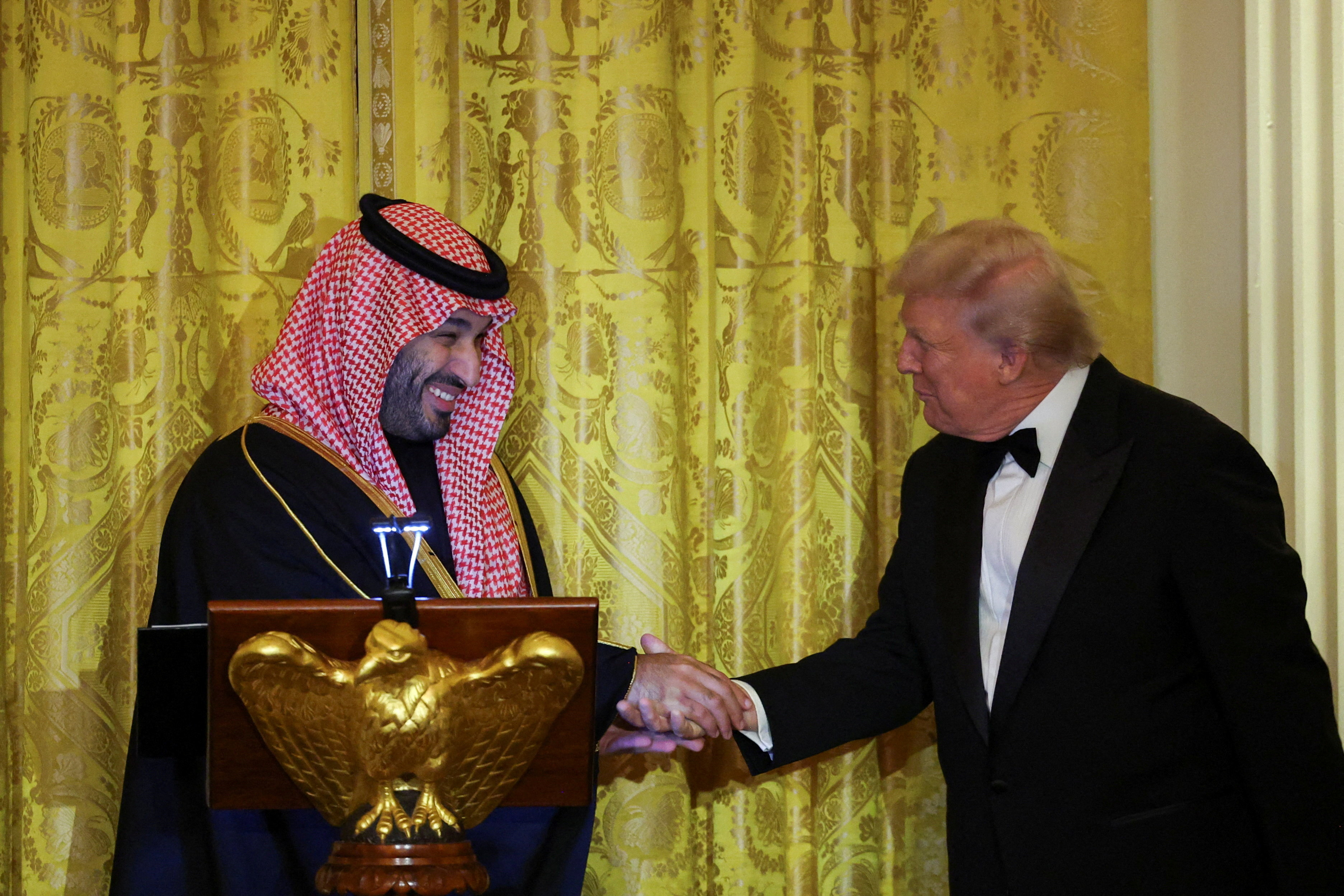 U.S. President Donald Trump greets Saudi Crown Prince and Prime Minister Mohammed bin Salman, during a dinner at the White House