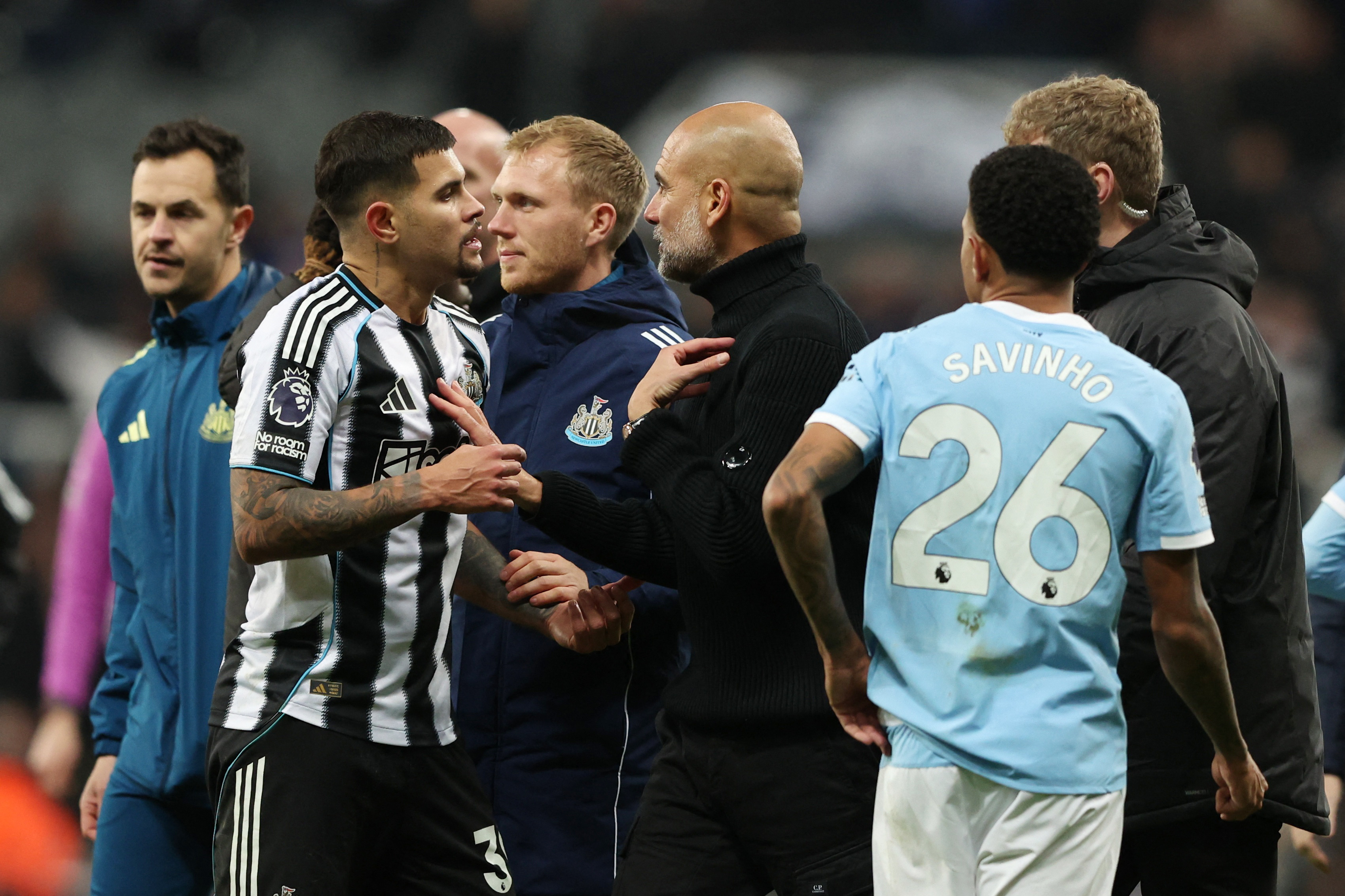 Soccer Football - Premier League - Newcastle United v Manchester City - St James' Park, Newcastle, Britain - November 22, 2025 Newcastle United's Bruno Guimaraes clashes with Manchester City manager Pep Guardiola after the match REUTERS/Scott Heppell EDIT