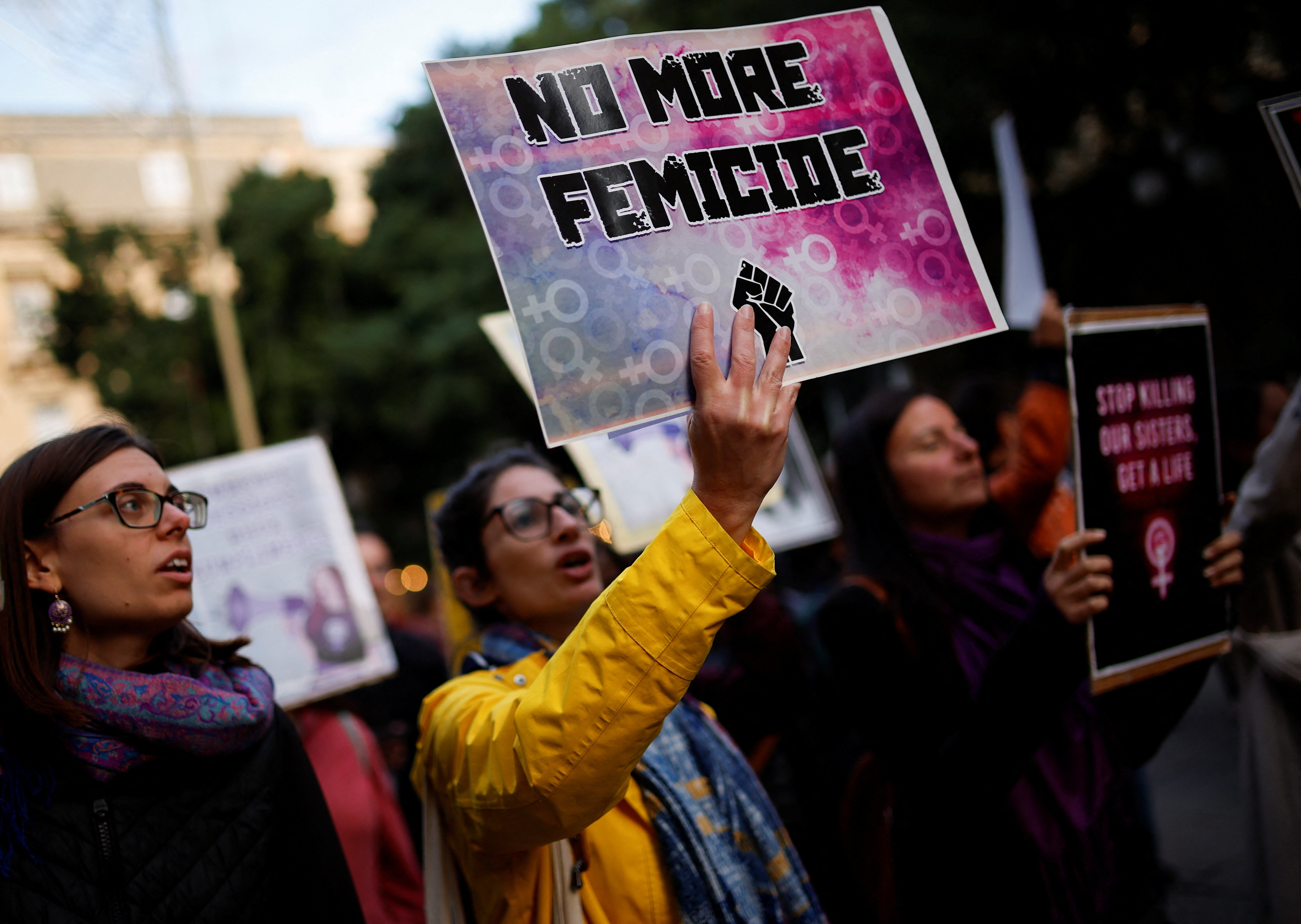 People attend a demonstration to protest against femicide, sexual violence and all gender-based violence ahead of the International Day for Elimination of Violence Against Women, in Valletta, Malta